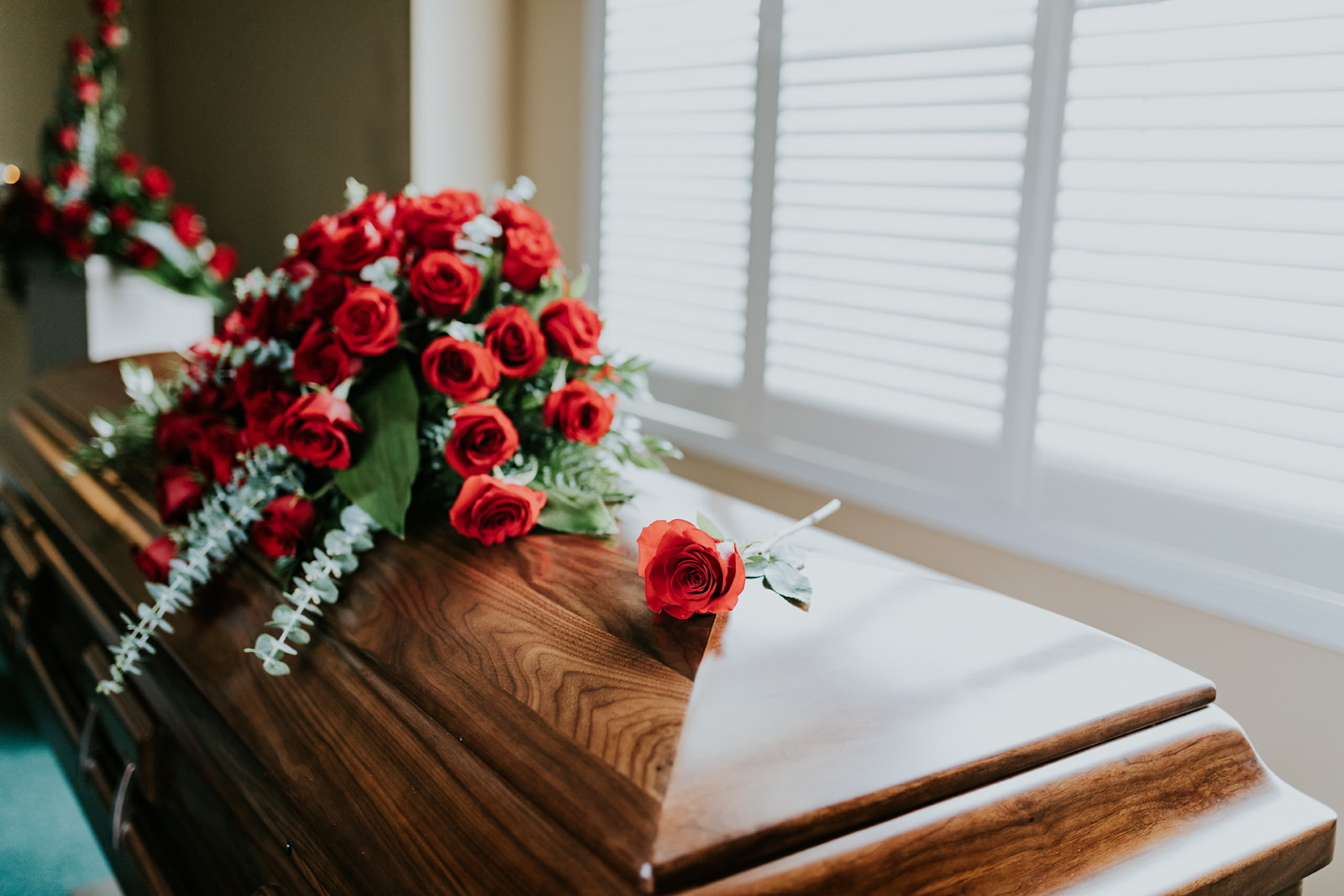 Placed Rose on Casket