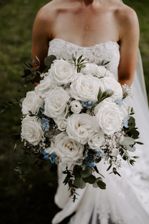 Bridal Bouquet by WSFloral with White Roses and a touch of light blue.jpg