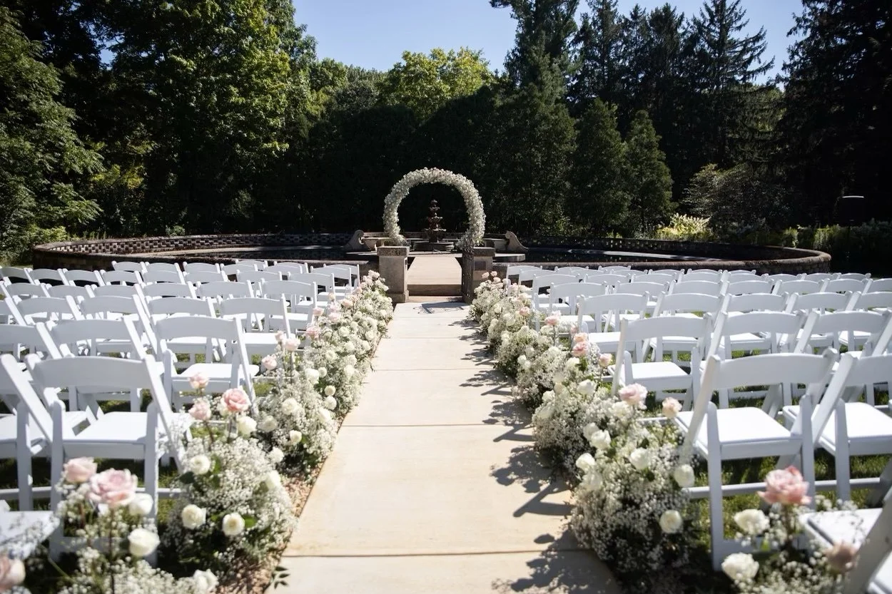 Baby's breath and roses aisle arrangements by WS Floral.jpeg
