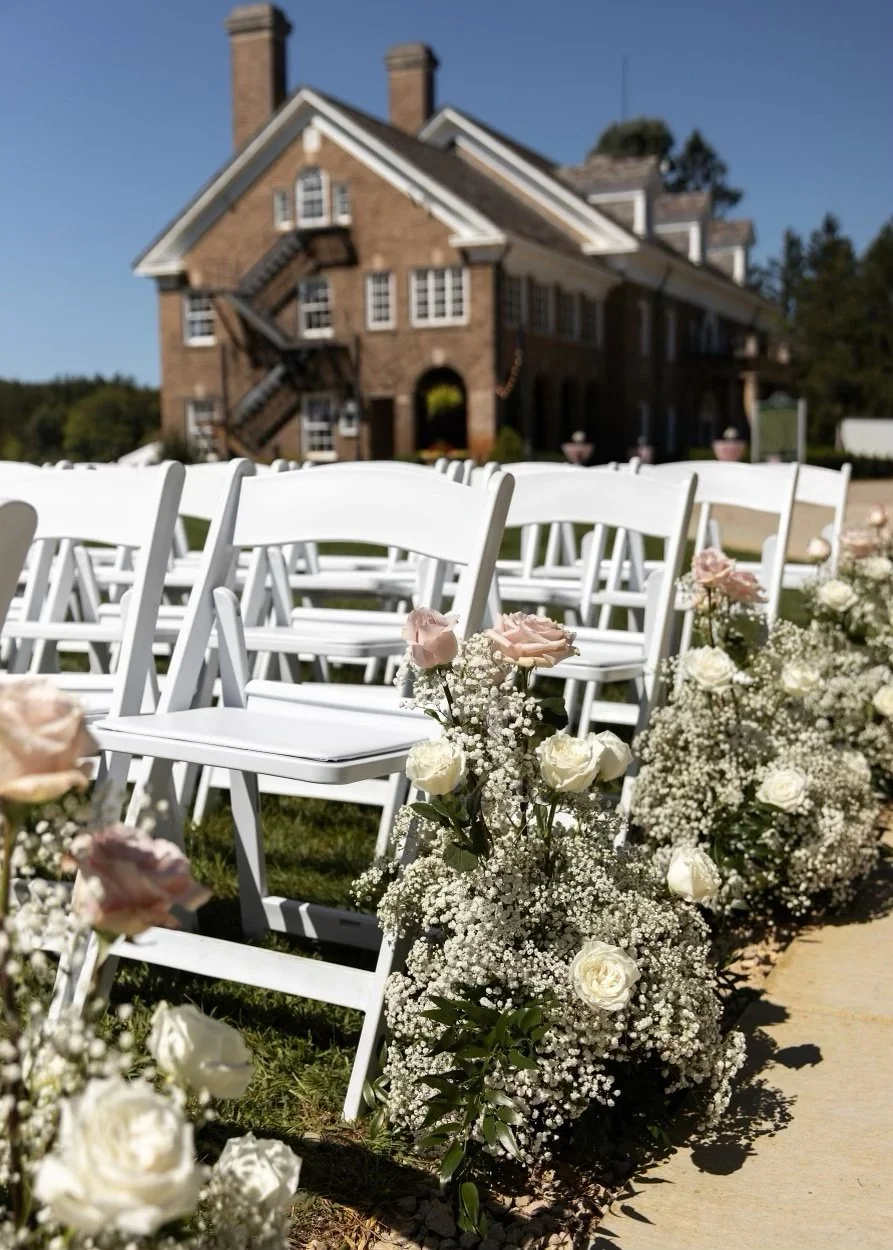 Baby's breath and roses aisle arrangements by WS Floral.jpeg