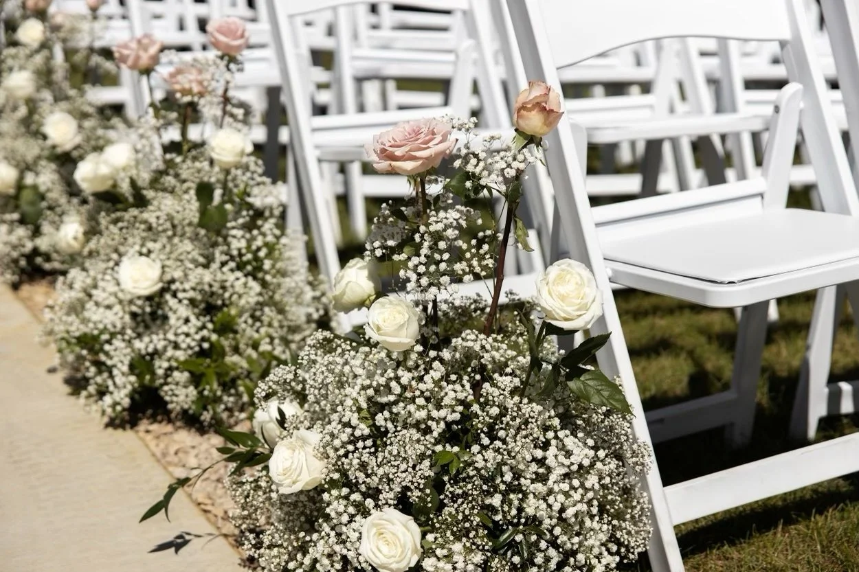 Baby's breath and rose aisle arrangements by WS Floral.jpeg