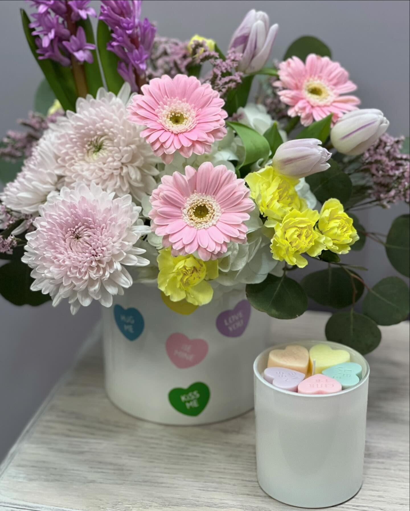 Just the cutest pairing ~ this conversation heart candle and conversation heart themed floral arrangement.