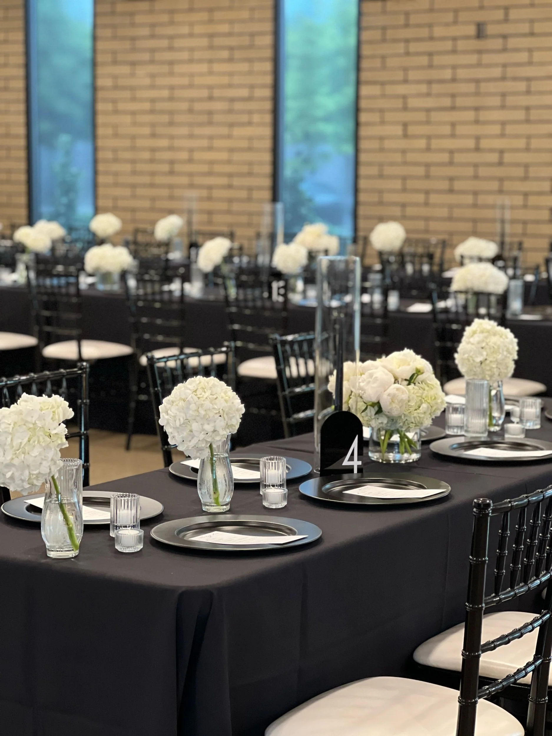 White hydrangea table arrangements by WS Floral.jpeg
