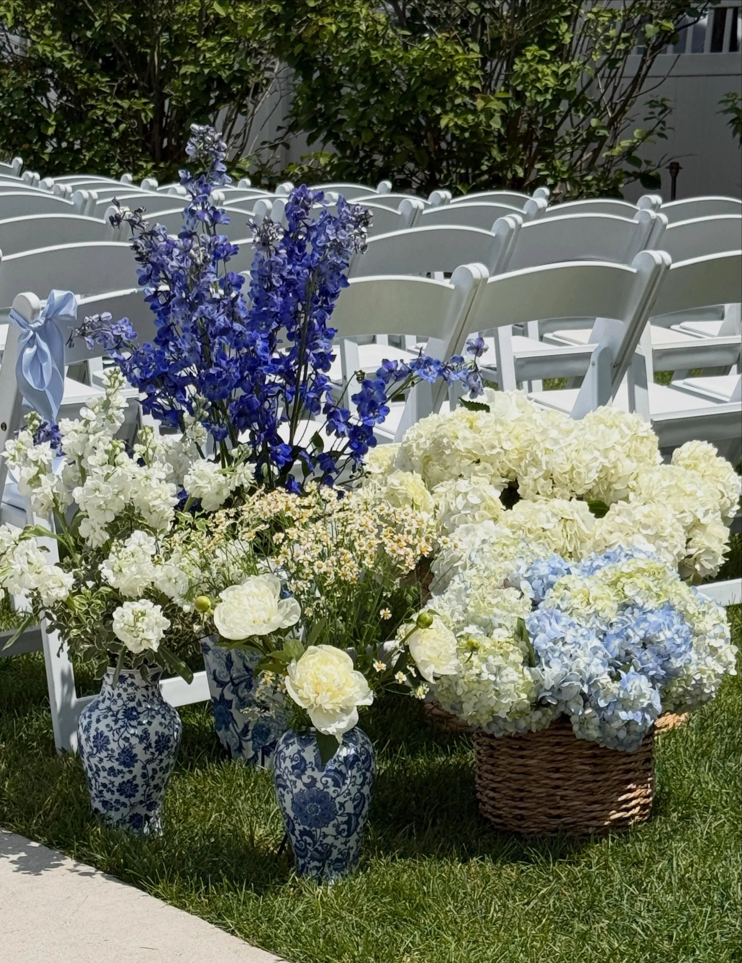 Aisle entrance vignettes for Saturday&rsquo;s wedding at Bay Pointe Inn, Waterfront Pavilion on Gun Lake in Shelbyville, Michigan. We loved bringing Kayla&rsquo;s wedding day vision to reality with baskets of peonies and hydrangea and beautiful blue 