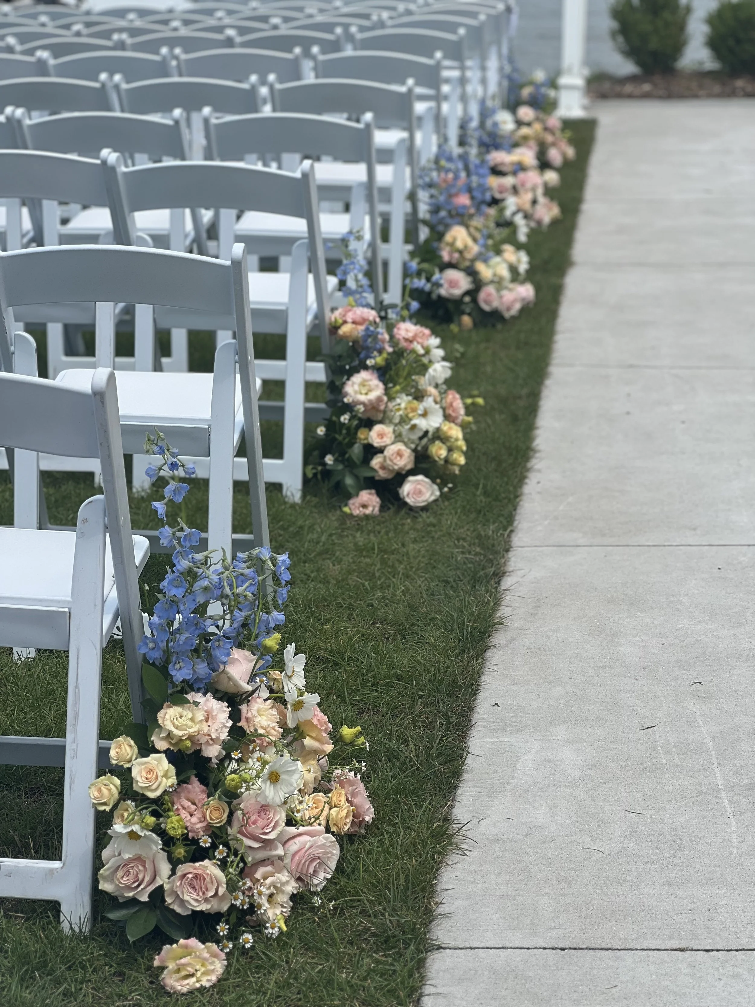 Pink, white, and blue aisle arrangements by WS Floral.jpeg