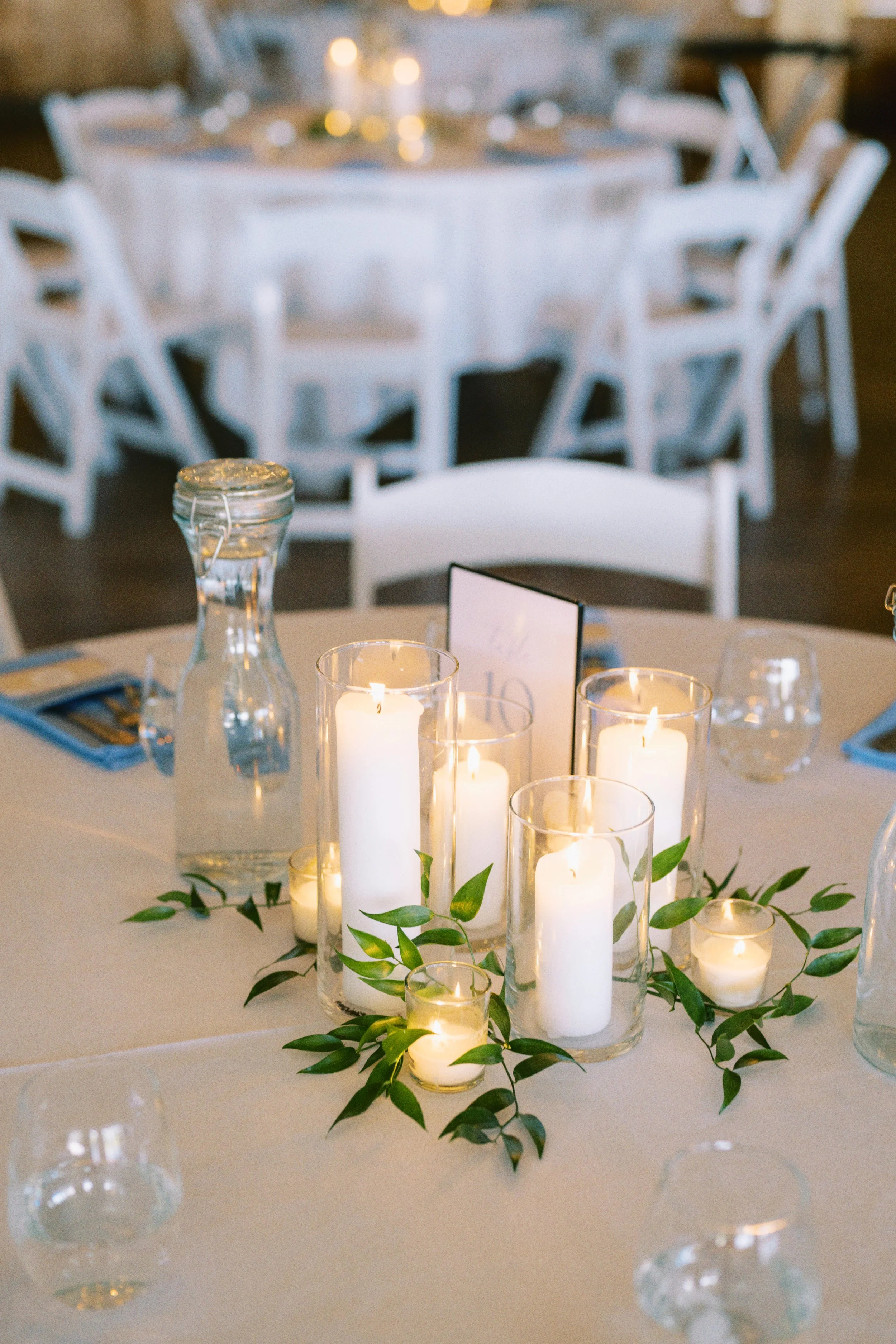 Candles and greenery centerpiece by WS Floral.jpg