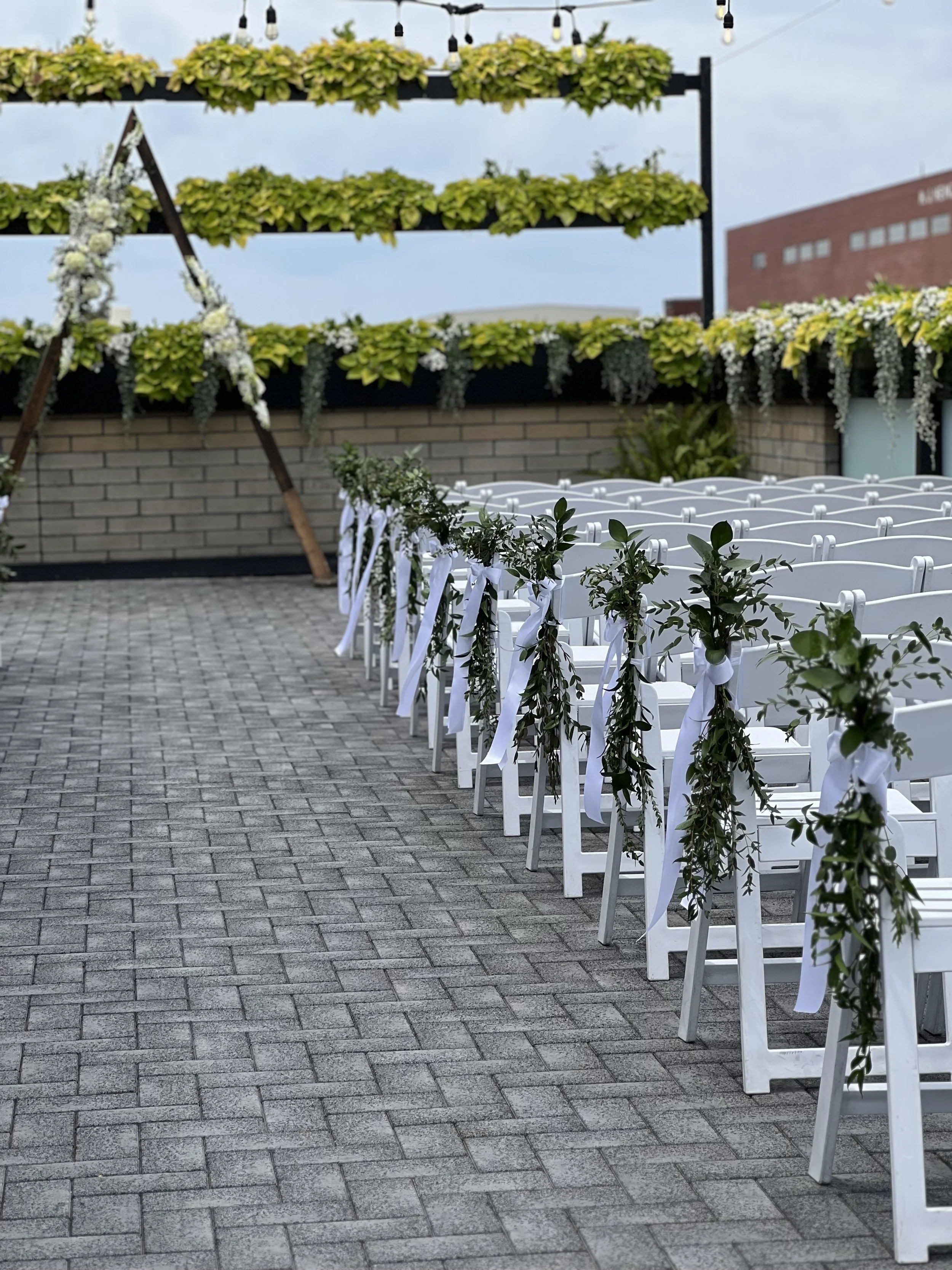Aisle greenery by WF Floral at Port 393 rooftop.jpeg