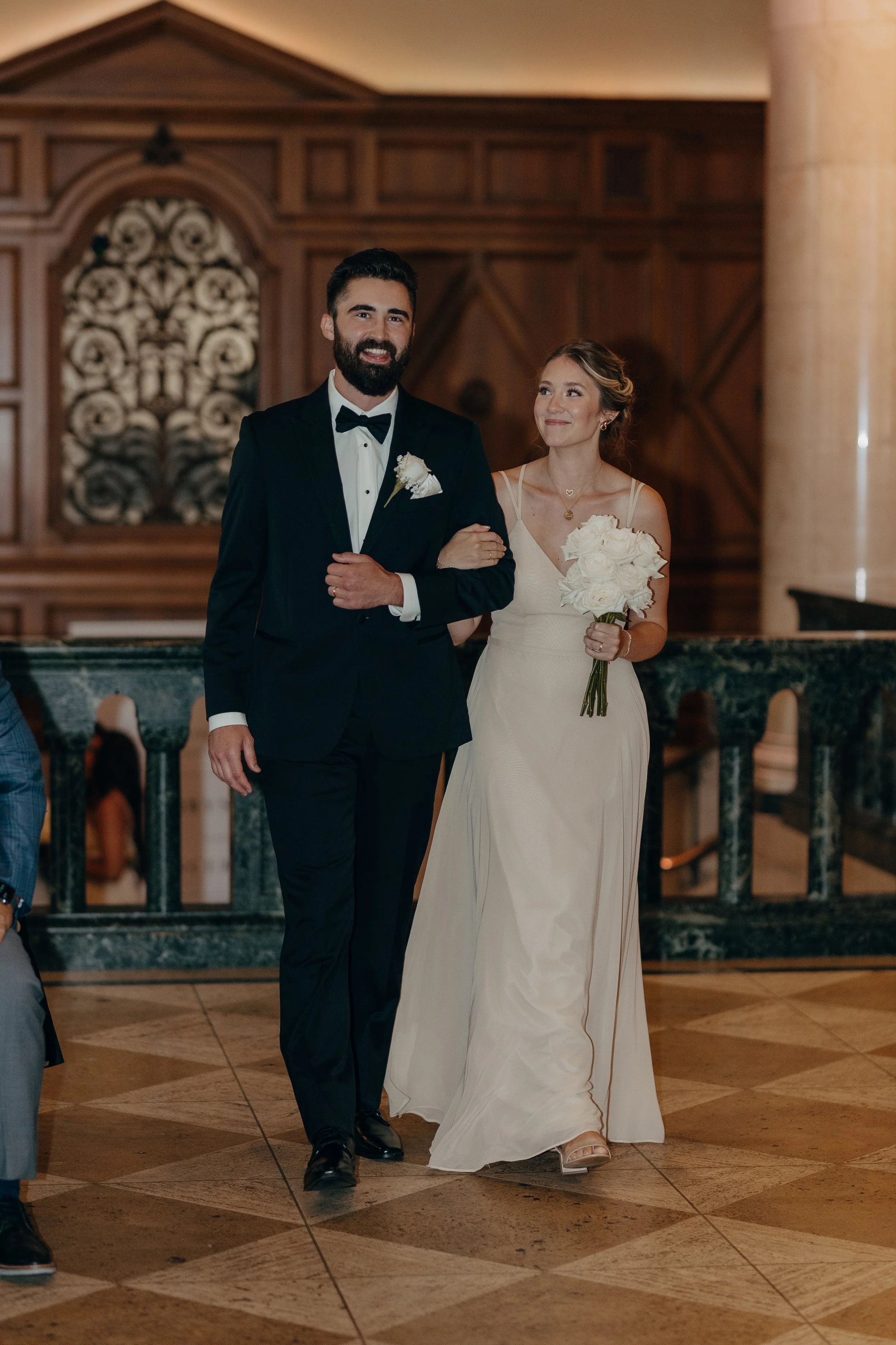 Bridesmaid carrying all white roses by WSFloral.JPG