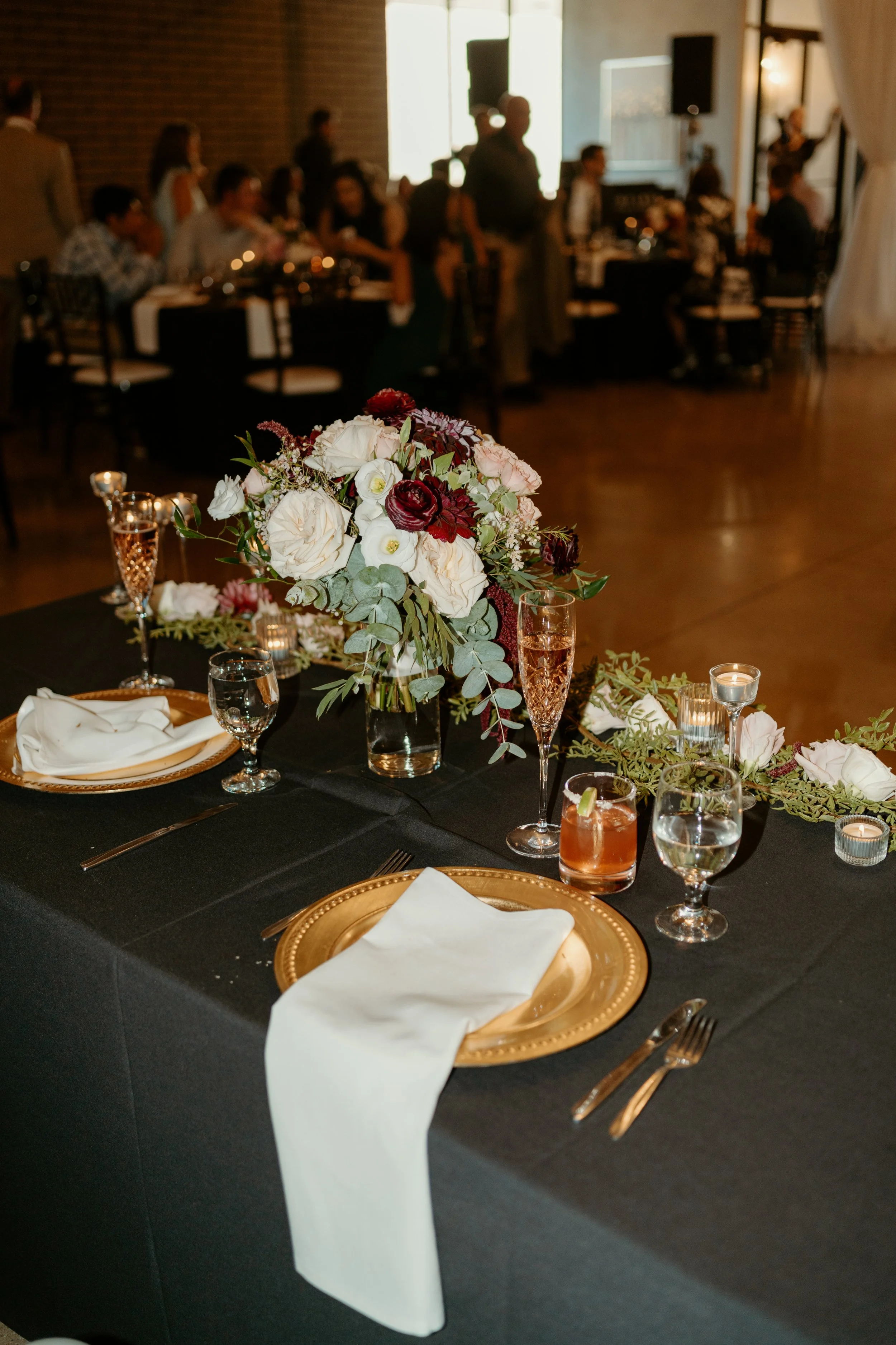 Blush, maroon, and white centerpieces by WS Floral.jpg