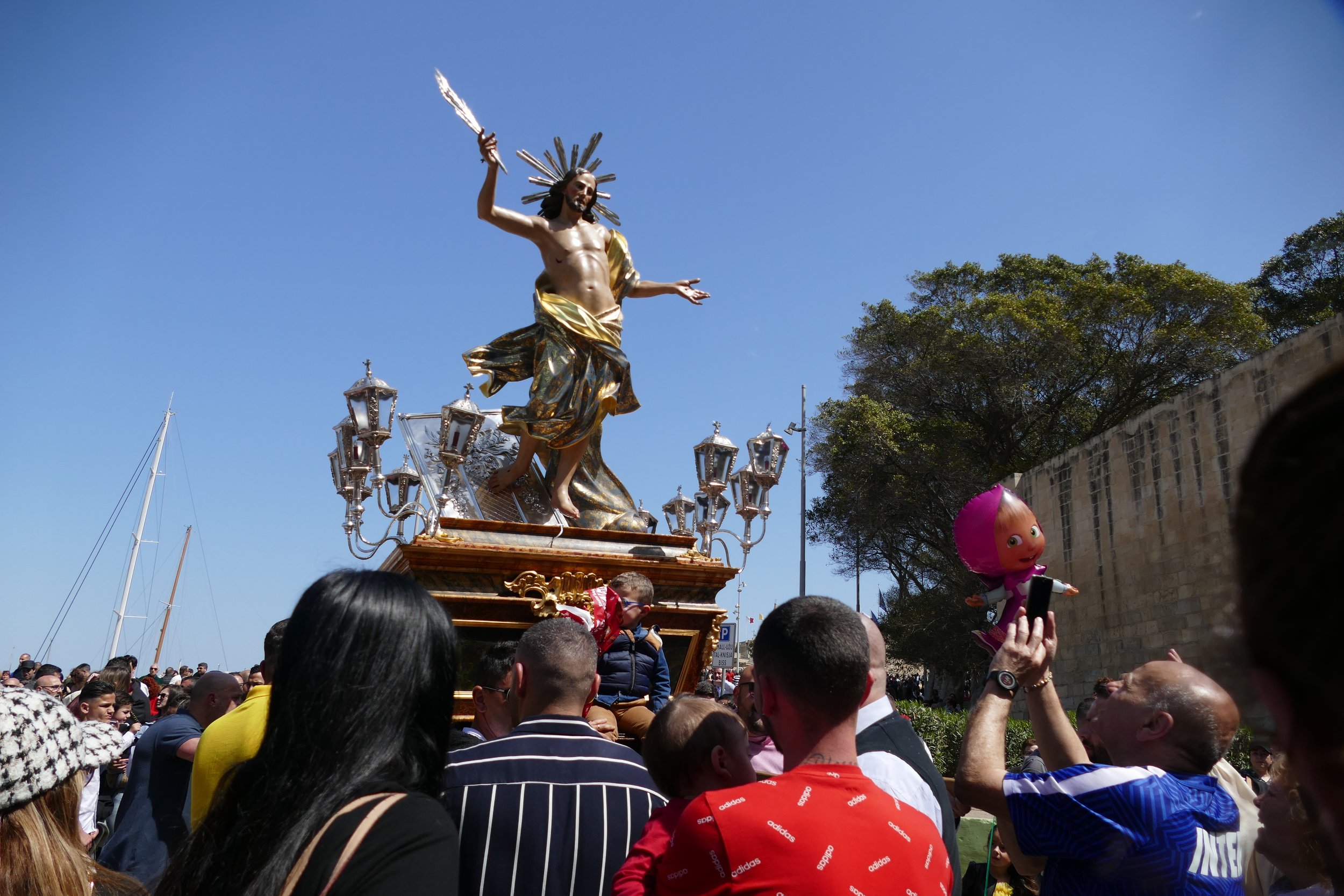   Easter Parade carrying the Risen Christ Statue  