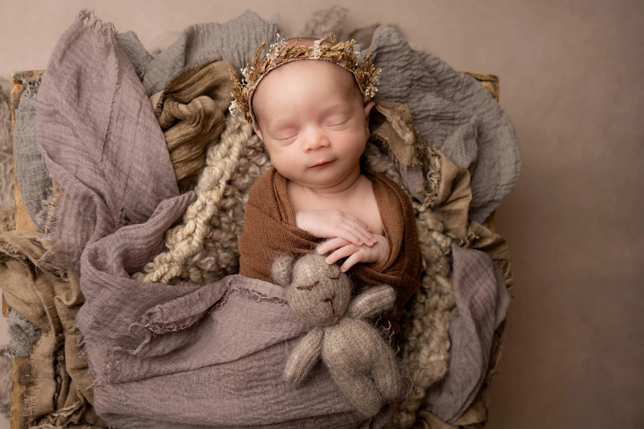 Sleeping newborn during professional newborn photoshoot in Bedfordshire