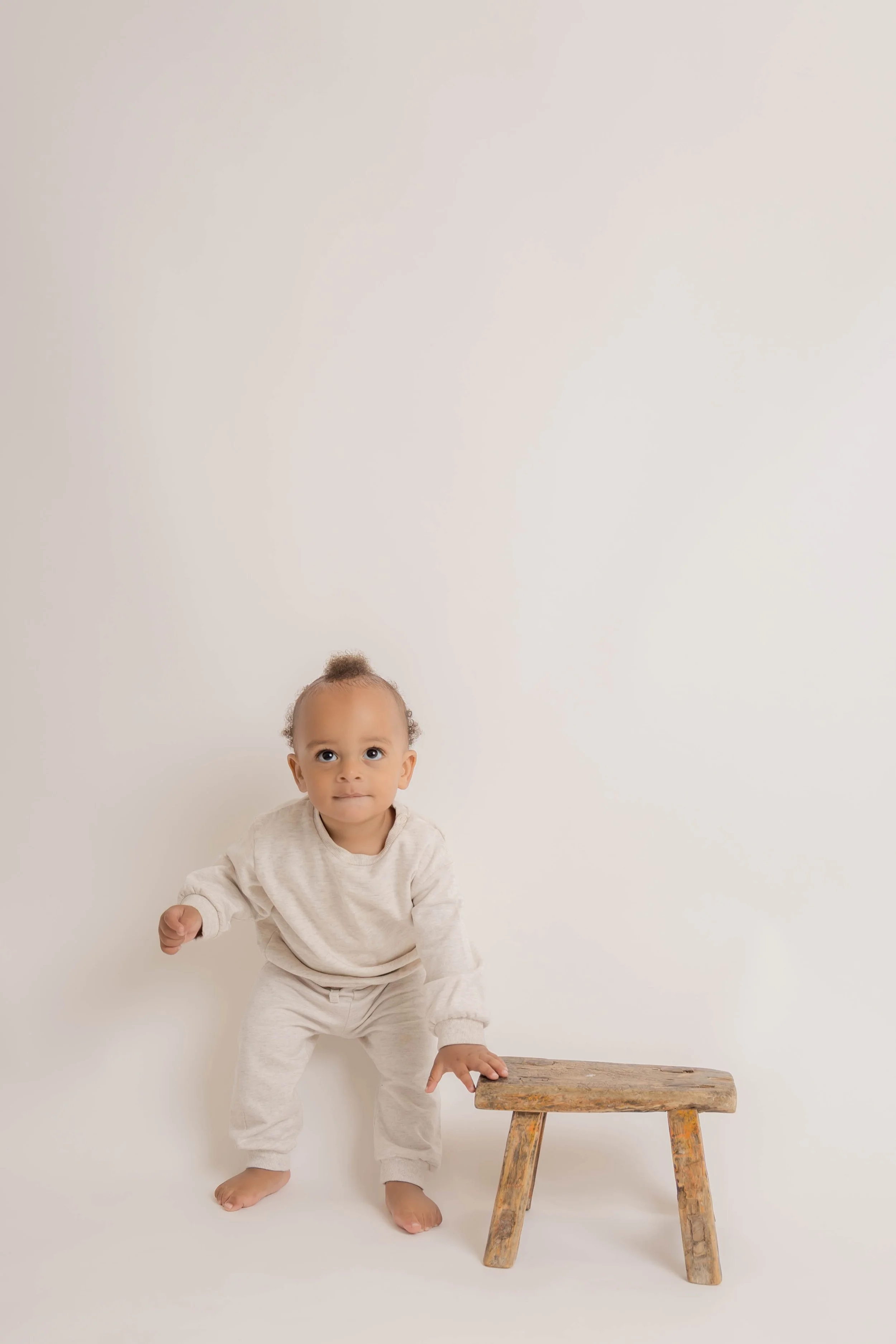 toddler making eye contact during a my babys first photoshoot session in befordshire
