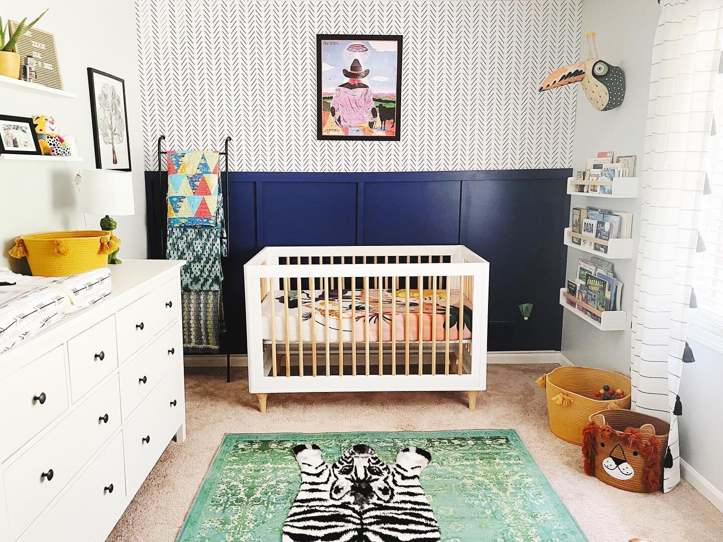 An eclectic nursery for our new baby boy. Did you know babies see B&amp;W objects best due to its stark contrast? So I added fun black and white elements like the wallpaper and curtains with bold pops of color for our infants developing eyes. When de