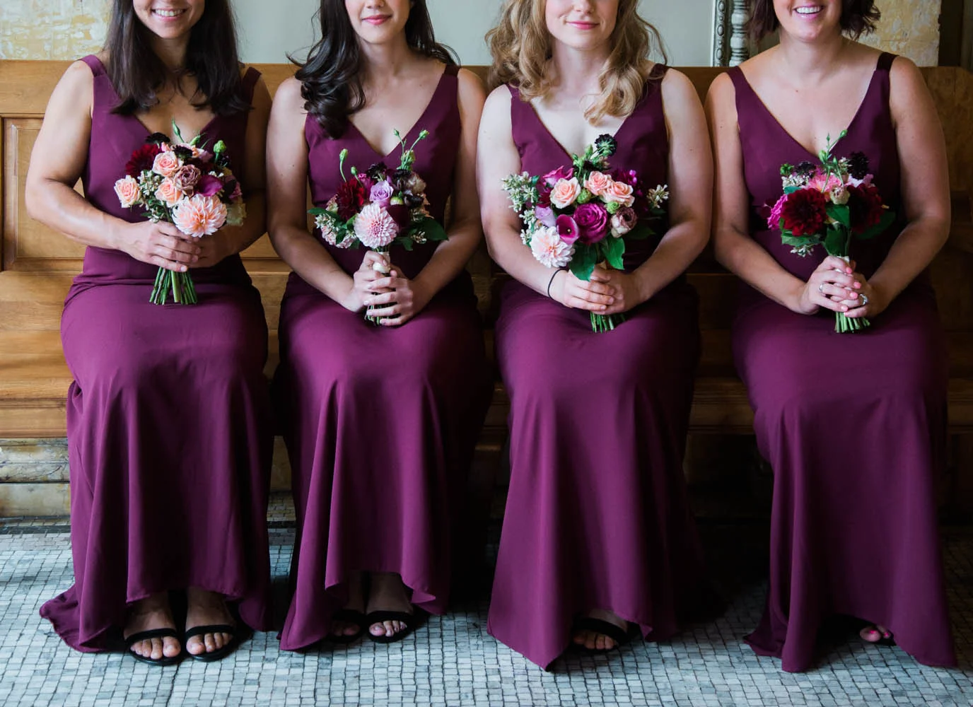 Ephemera Designs Four Bridesmaids sit holding Four Pink & Fuchsia Bridesmaids Bouquets