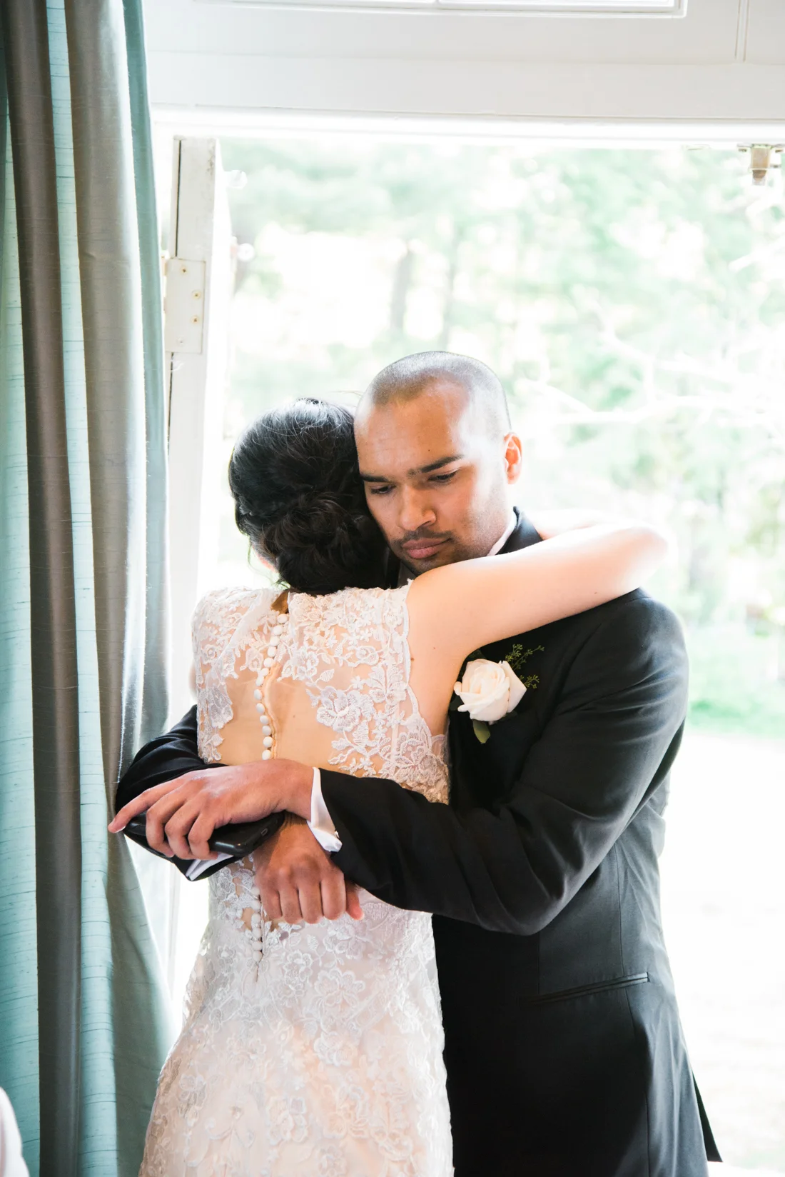 Ephemera Designs Rhode Island Alternative Wedding Photographer Bride Hugging Groomsman