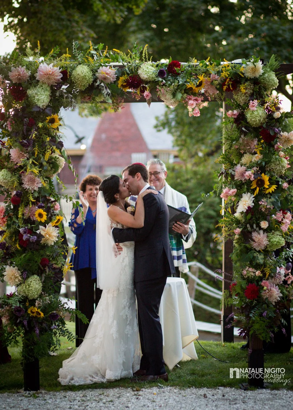 Ephemera Designs Square Floral Chuppah with Kissing Bride & Groom Below