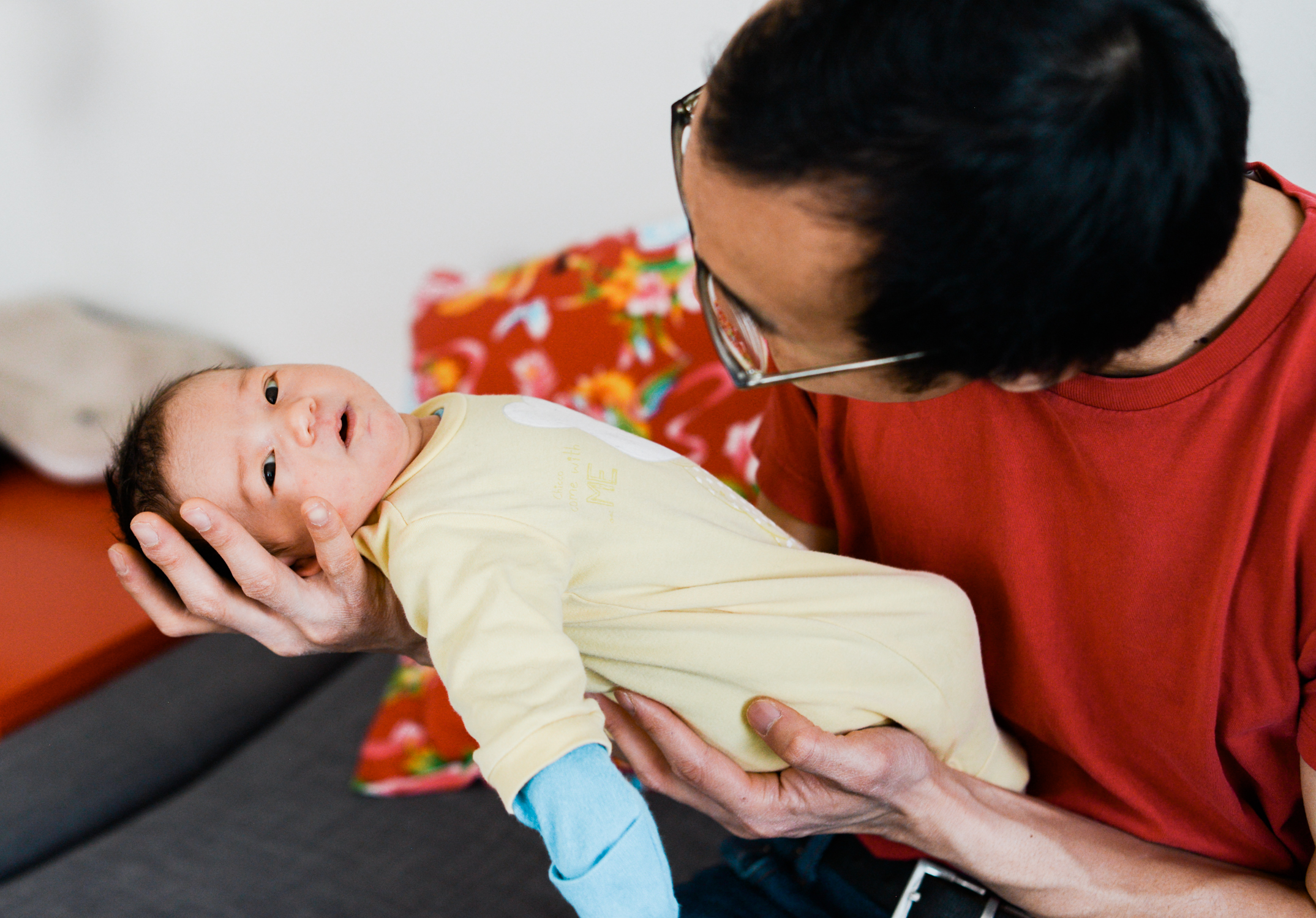 Ephemera Designs Maternity Photography with dad looking down at newborn son in his arms