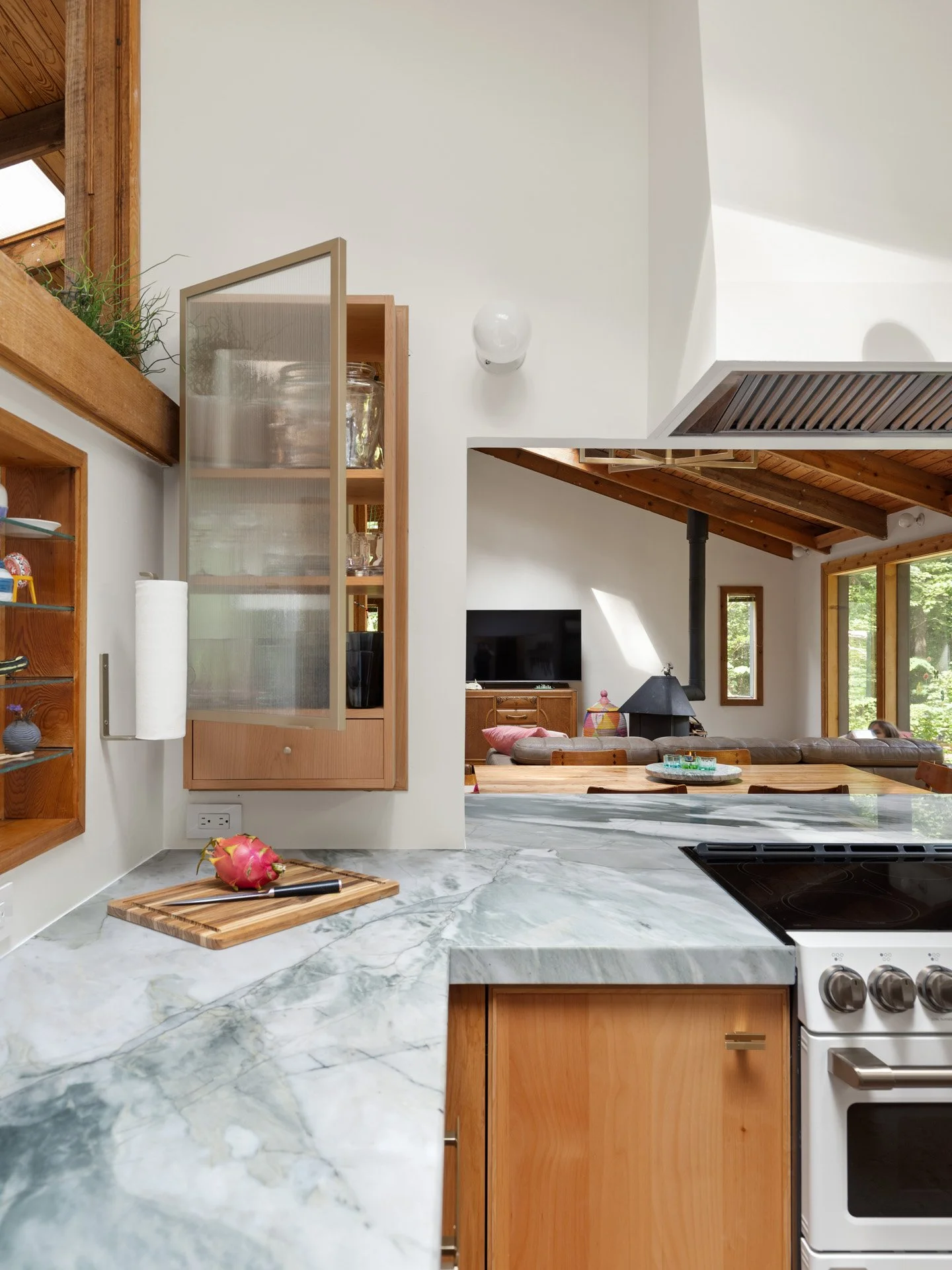 Built in cabinet with pass-through drawer and ribbed glass door.