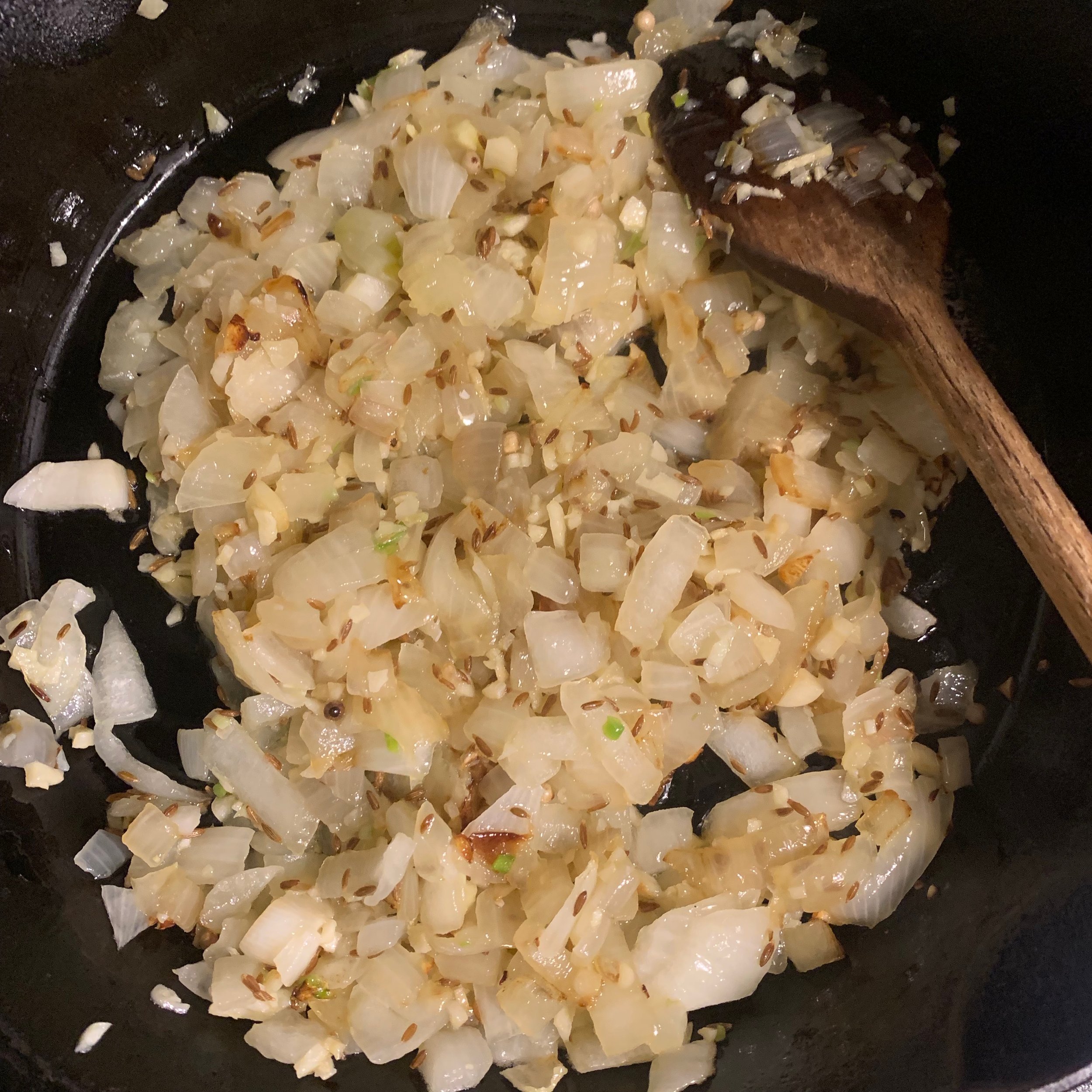 I added some whole cumin and the garlic near the end of the sautéing onions