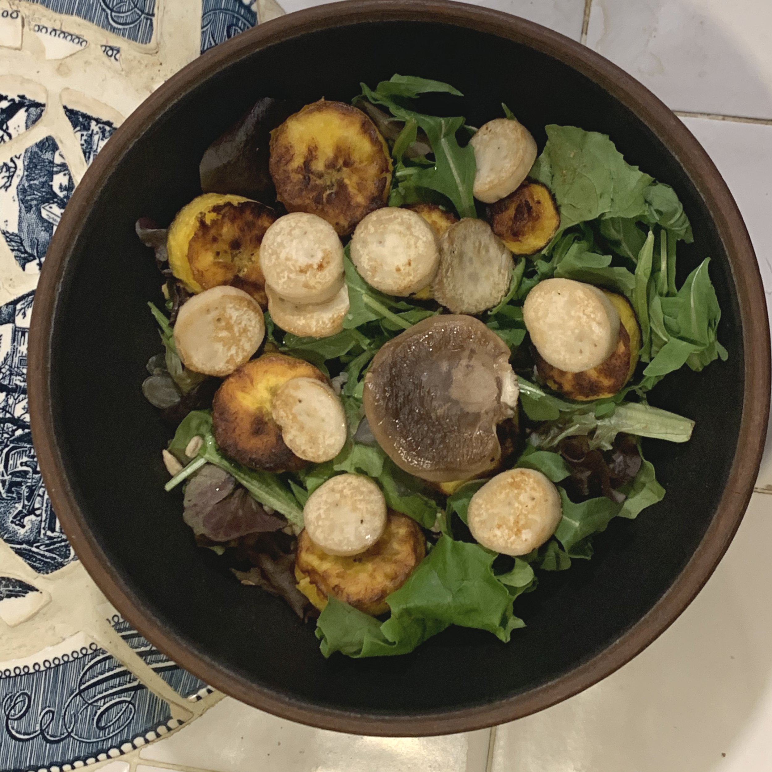dry roasted trumped mushroom and plantain added to a spring mix salad