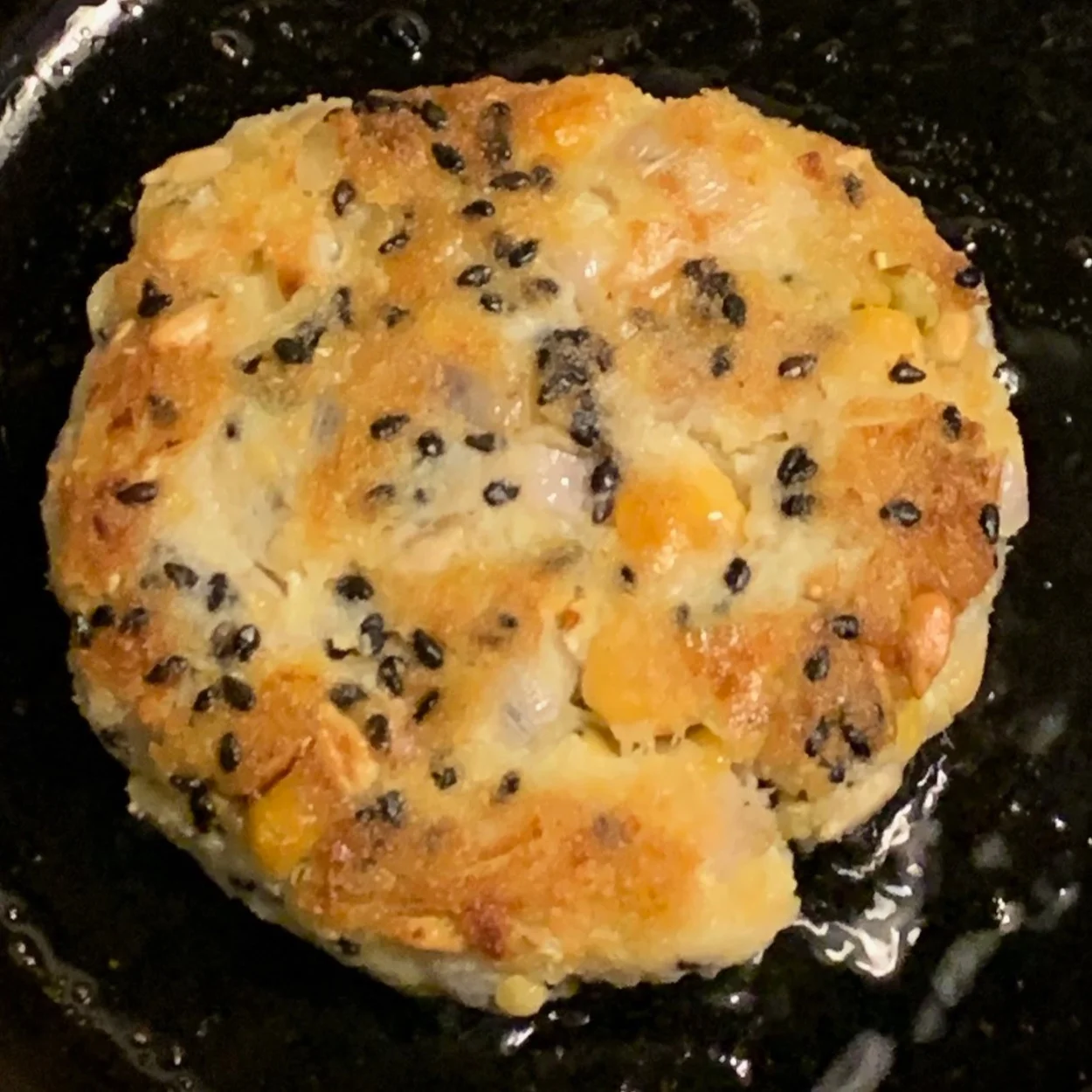 cabbage cakes with butter beans and sesame seed