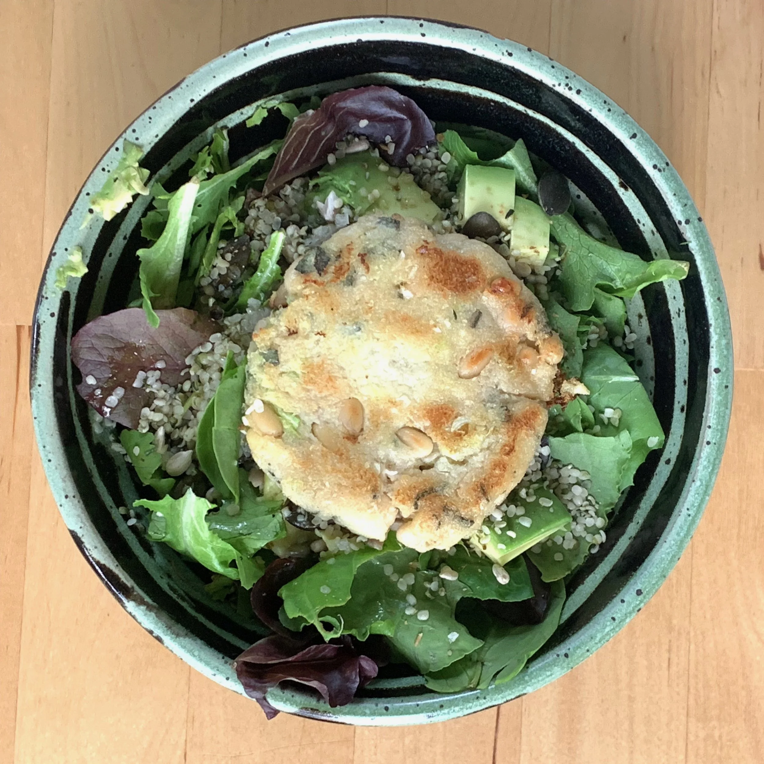 I like to eat my cabbage cakes without a bun, so I often toss it on top of a salad.
