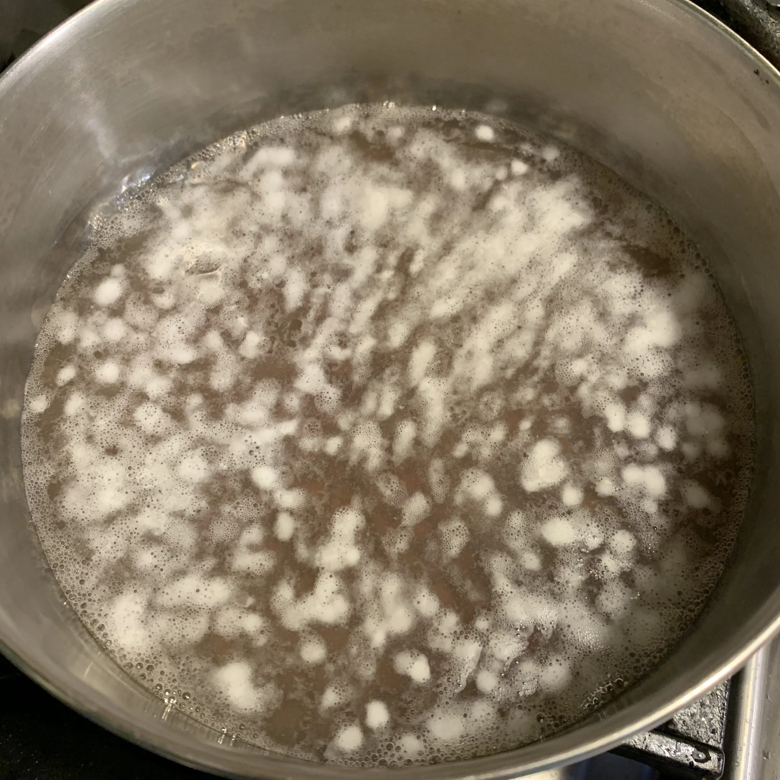 scum forming as the beans heat up the first time