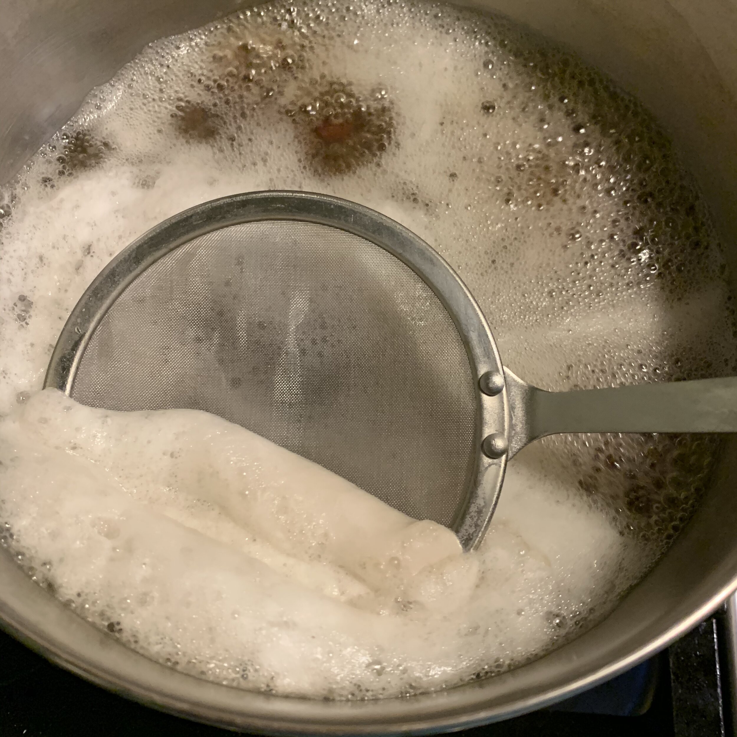 skimming scum off the first boil