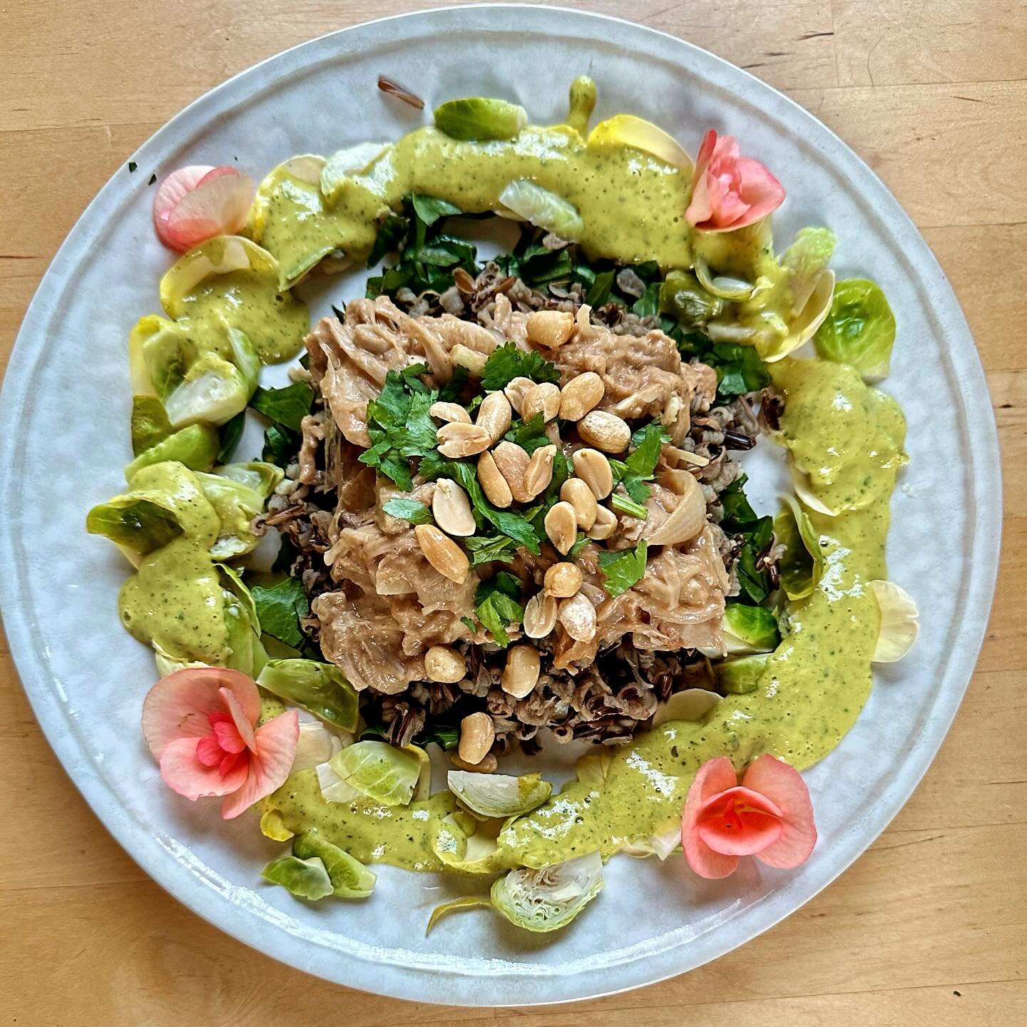 Rose petals and begonias ~ the rest of the dinner? Saut&eacute;ed savory peanut jackfruit on top of bloomed wild rice  on top of dandelion greens, surrounded by steamed Brussels sprouts on rose petals glazed with mint mango sauce ~ 😋

#eatmoreflower