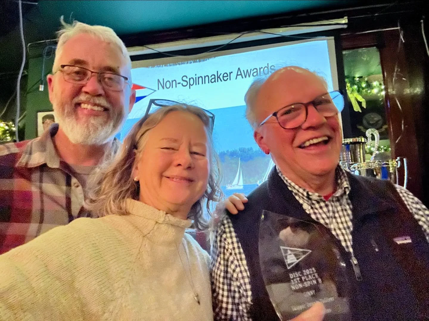 Capitalism @dennis.tolliver and crew @jjernigan1972 and me (missing Chris} receiving awards for the annual 2025 DISC sail race season dinner. 🥇🥈🥈🥉🥉 

Sailing and racing up and down the Potomac river is challenging and tons of fun, nature and us 