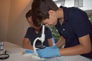 boy w microscope.png