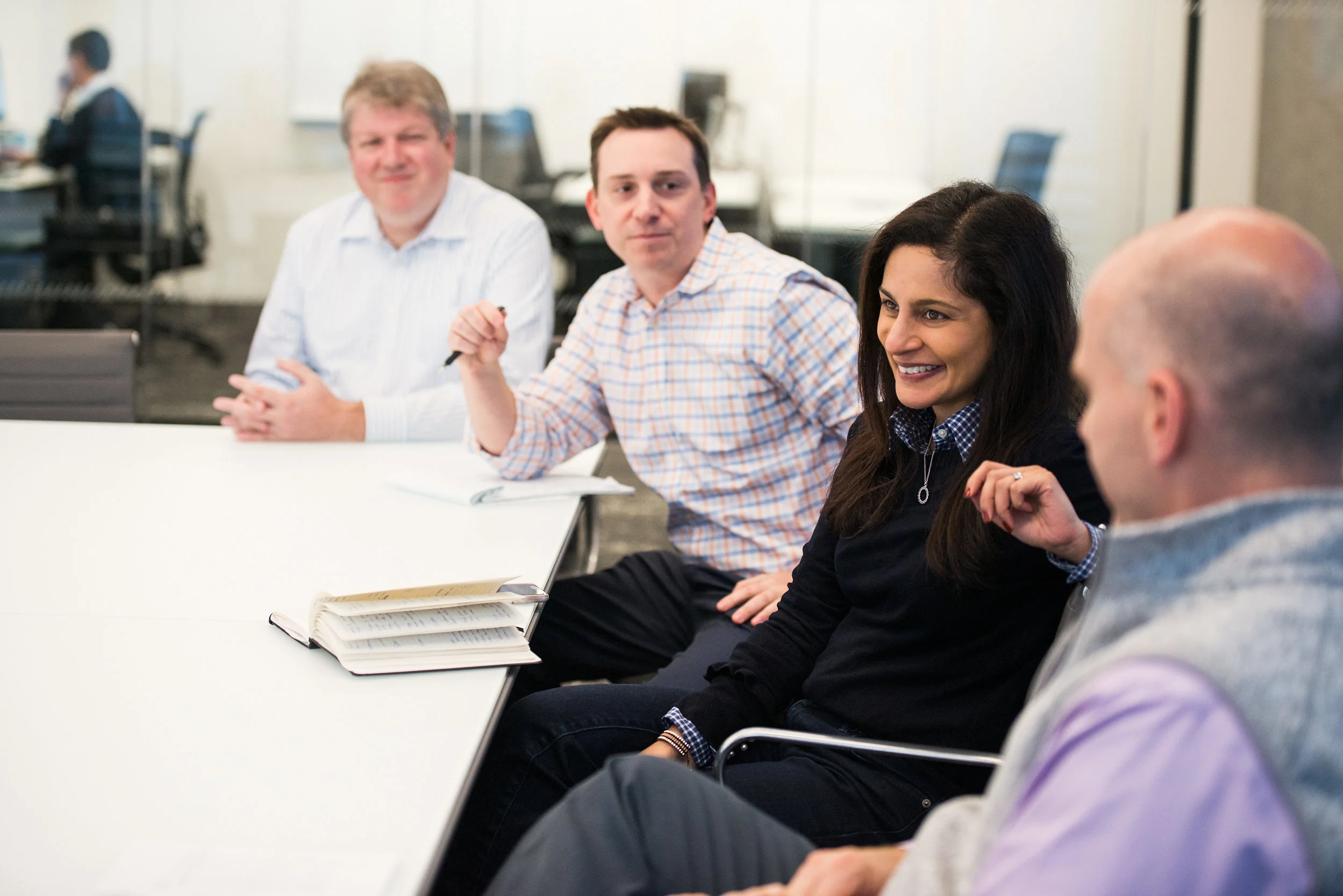 Global institutional investment network meeting with three participants and woman leader