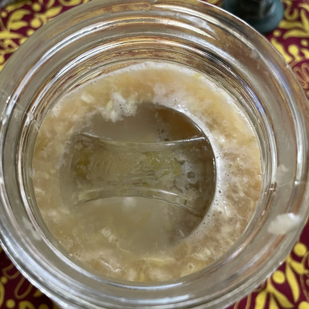 i do use glass fermentation weights. this is a few days later -- you can see the color changing
