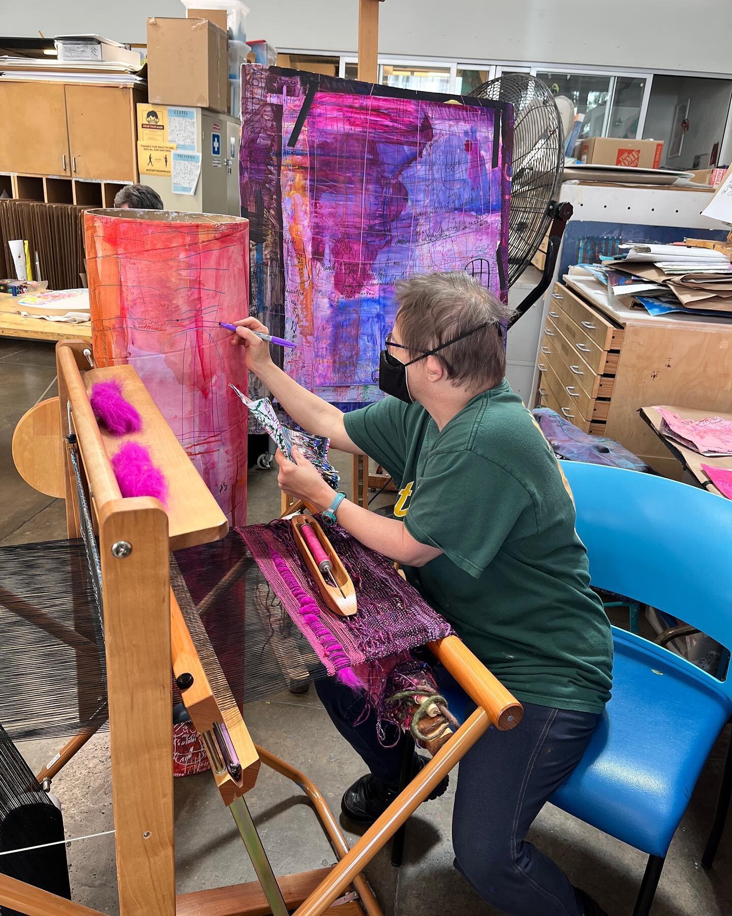 #NicoleStorm sets up the ultimate multitasking workspace!

Storm&rsquo;s work is currently featured in &ldquo;Creative! Growth!&rdquo; on view at @jmkac through May 19, 2023.

Image 1: Nicole Storm sits at a loom while holding a sketch in one hand an