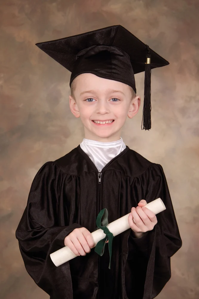 SchoolPhotosChildCapGown_667x1000.jpg