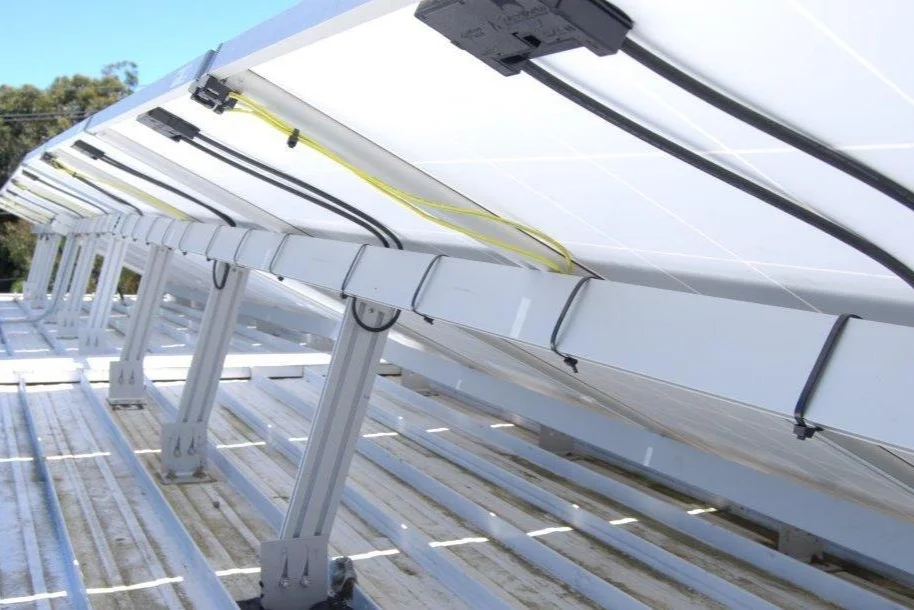 By angling the rear legs in a manner as to slant inwards, better bracing was achieved - important for this two-storey installation with significant wind loading.
