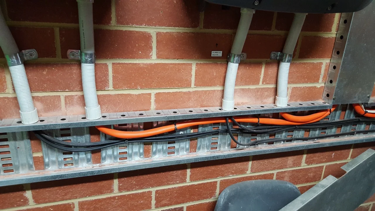 AC and DC cables in close proximity; touching even. Not permitted under the Australian standards.