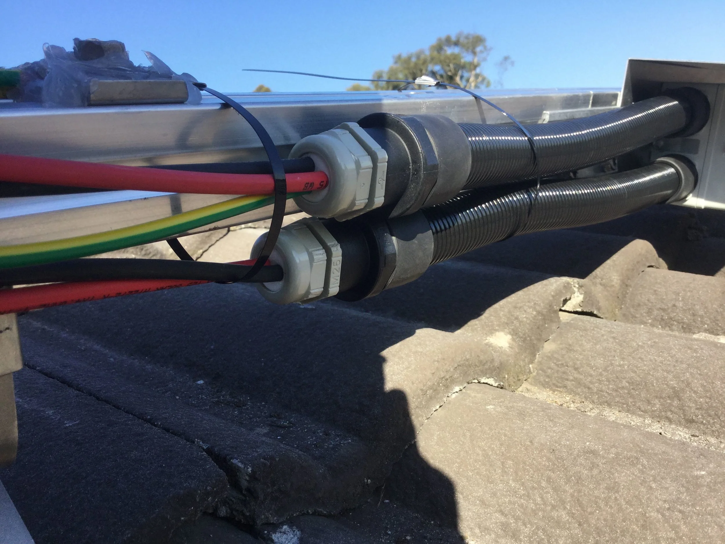 Photo uploaded into iEnergytech’s QC software “Soorya” and made available to the customer, shows the cable work on the roof.