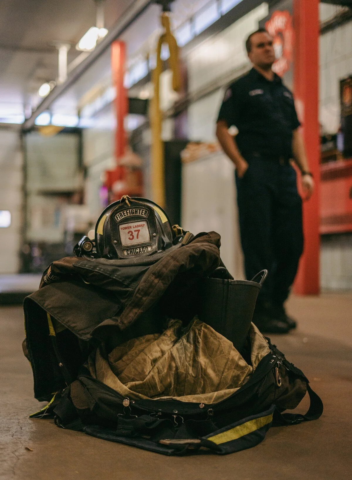  A firefighter’s uniform is stacked on the ground. 
