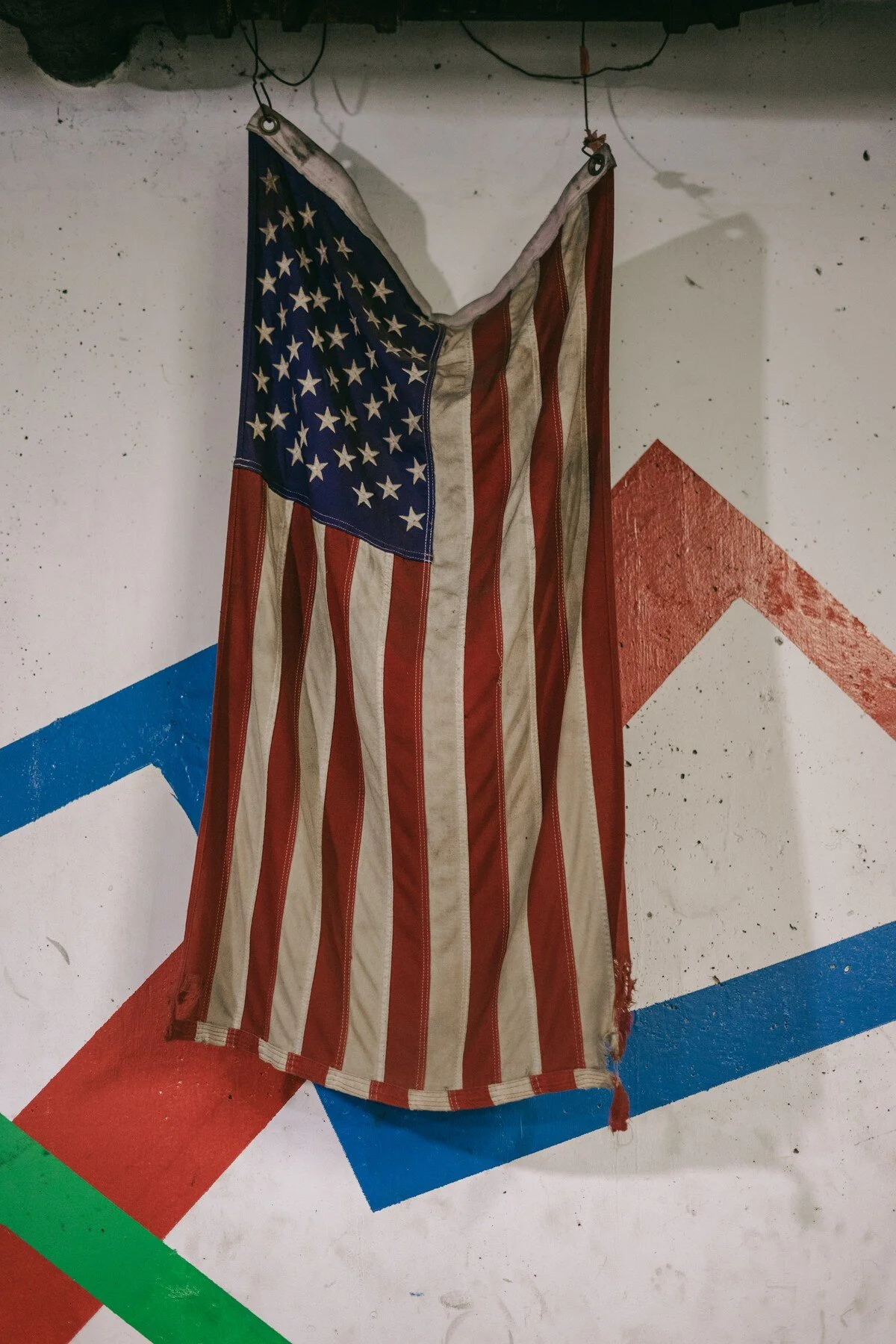  A charred and battered American flag hangs in the basement of the fire station. 