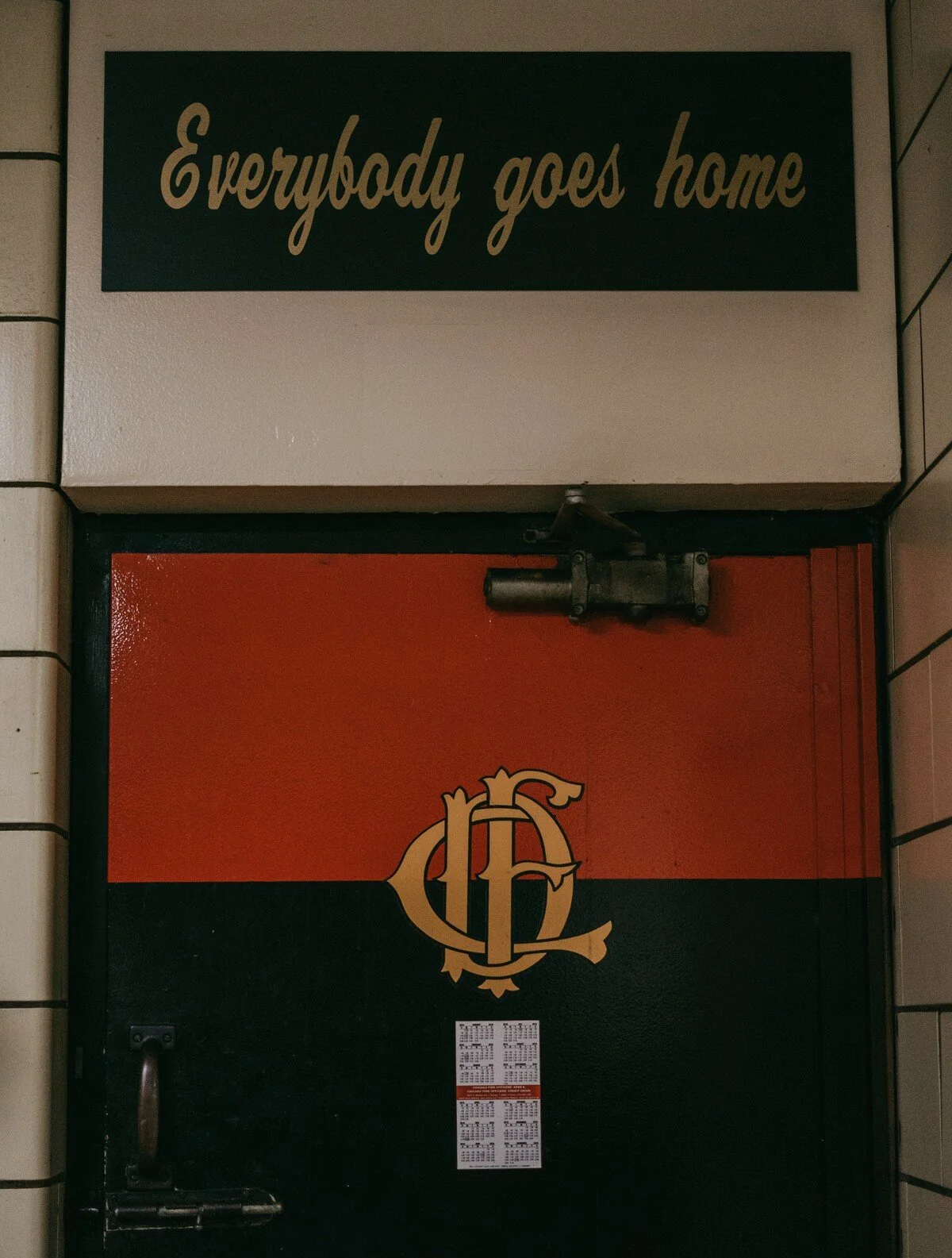  The fire station motto is written on top of one of the station’s doors reminding the fire fighters to never leave one another behind. 