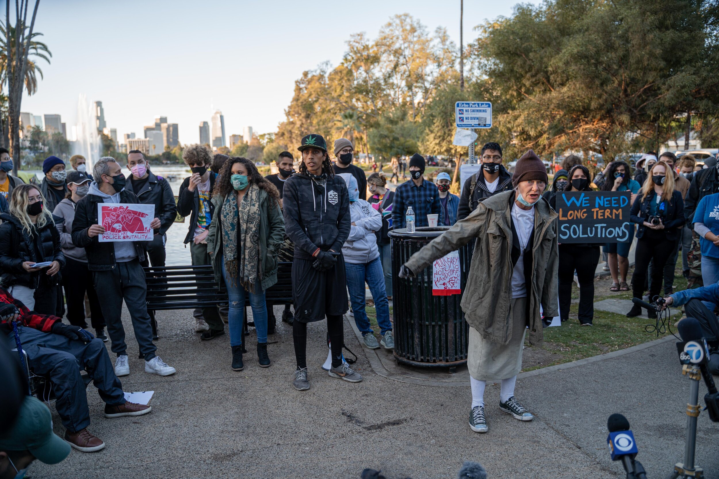 Valerie, a homeless resident of Echo Park Lake in Los Angeles, speaks to journalists during a protest against the park’s closure on March 24, 2021.