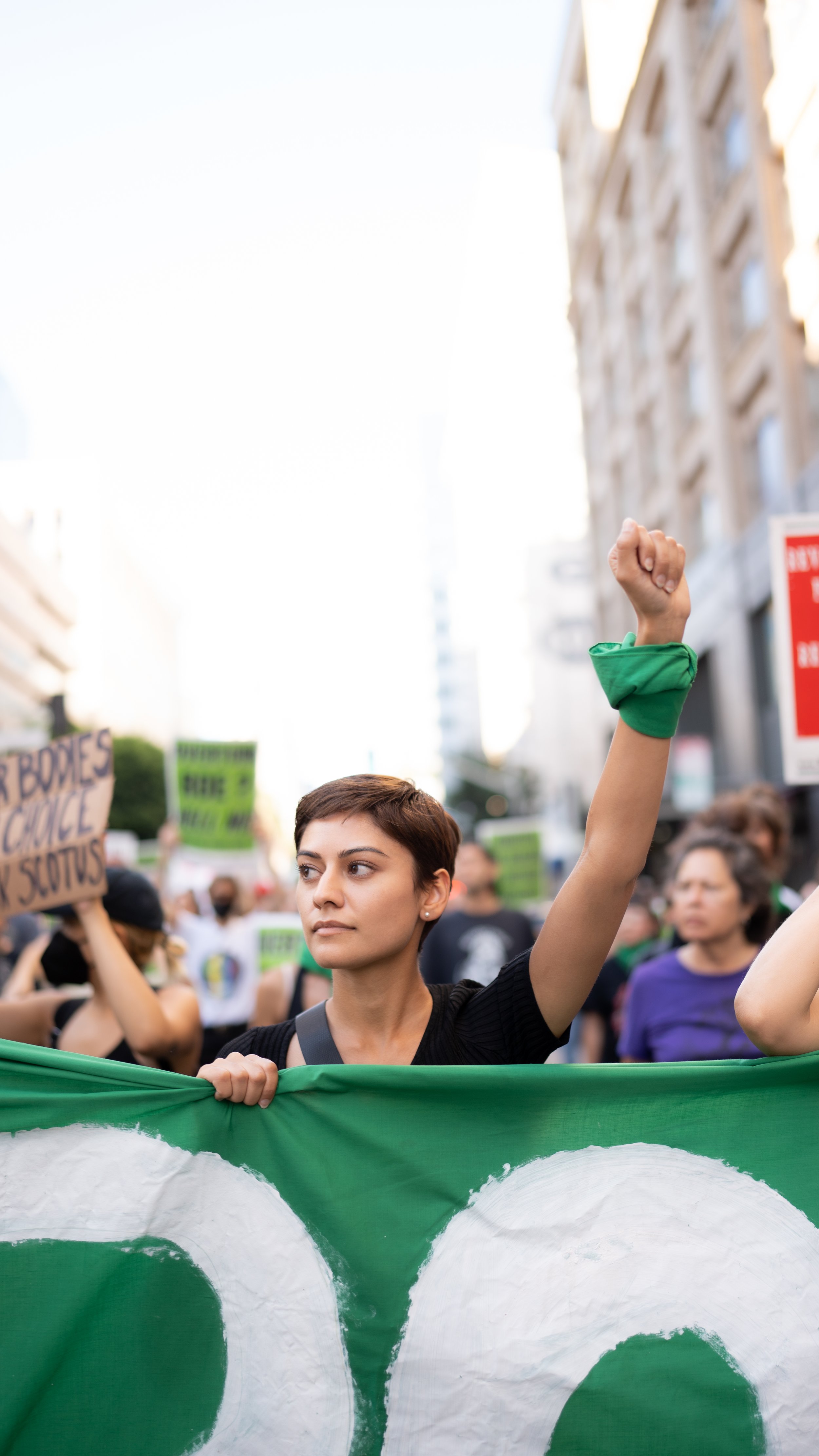 Protester raises a fist while marching - June 24, 2022