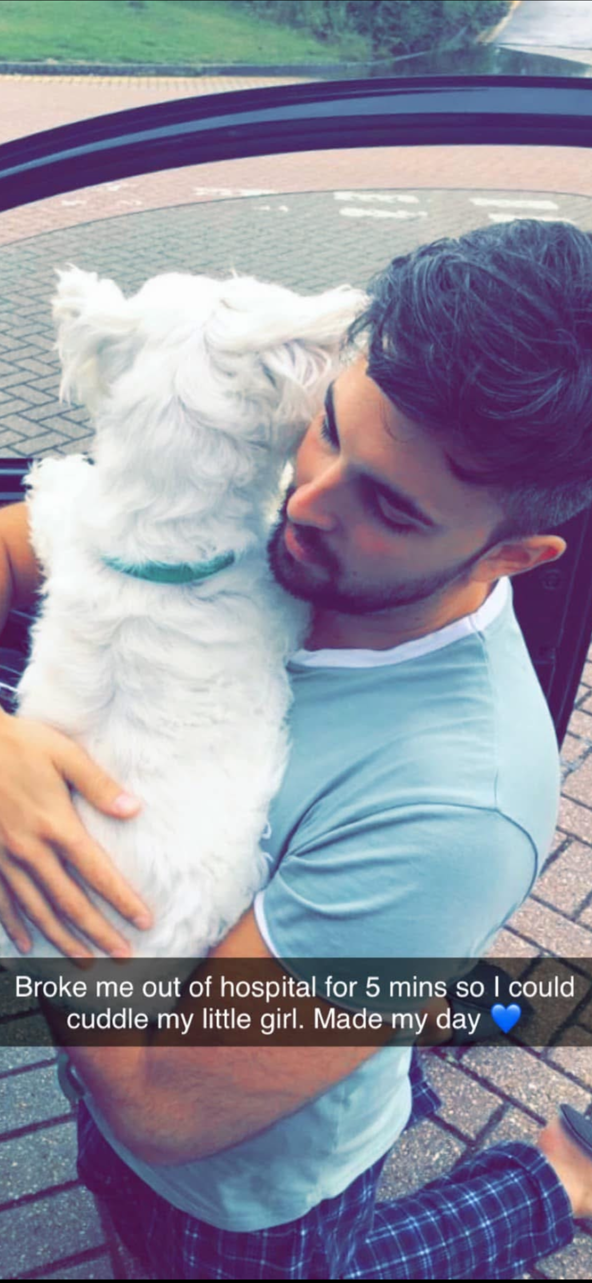Caerey Ball holding his daughter outside hospital during Crohn's disease treatment — it may hurt now