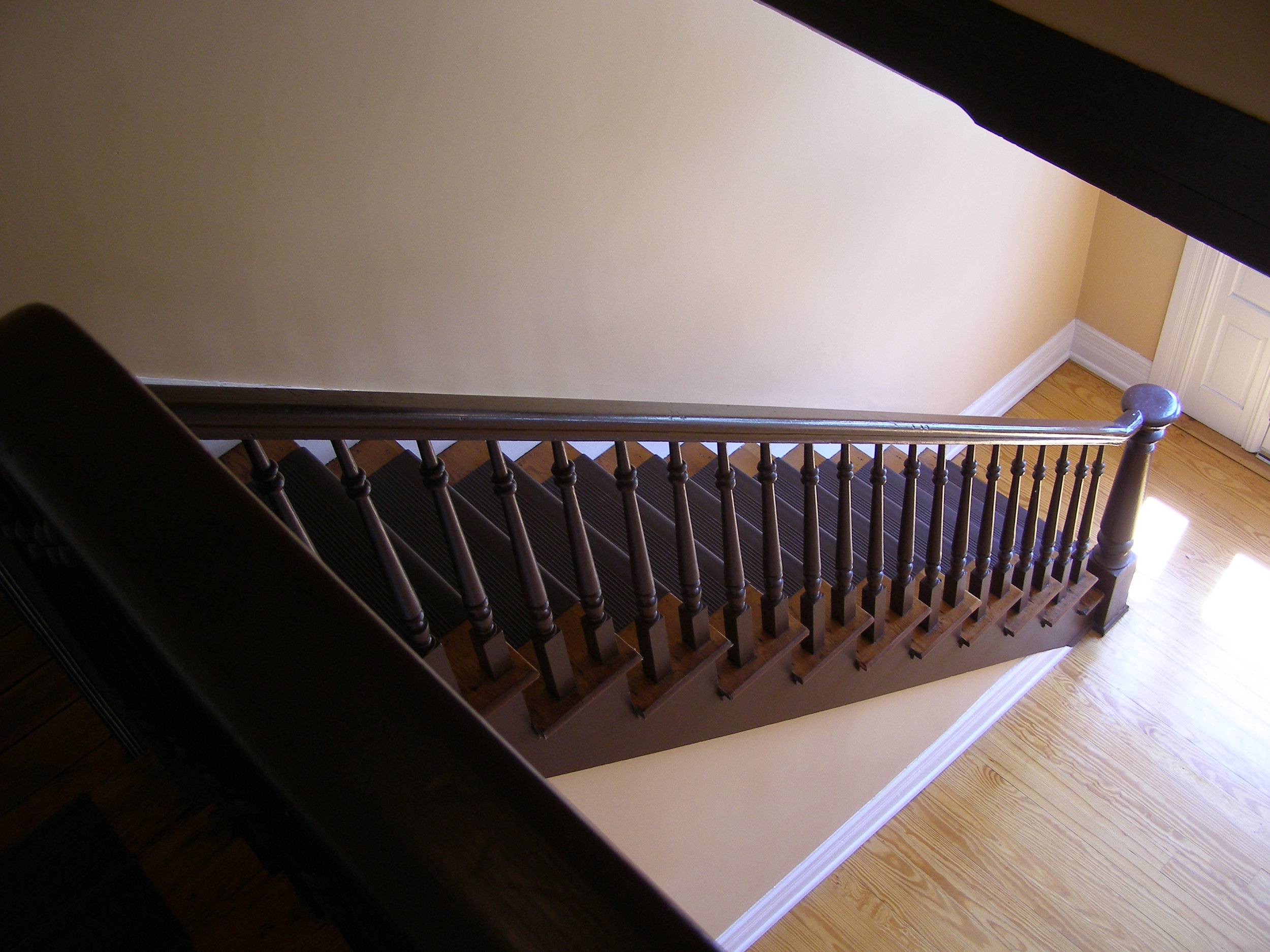 Canva - Brown Wooden Stairs in Front of White Wooden Door.jpg
