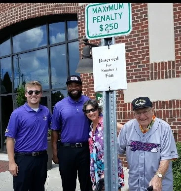 Mike and Reggie with Dad and me. The valet staff kindly “reserve” a parking space for Dad at every game.