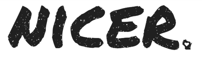 Young woman wearing a flowy soft moss greeGraphic of the word NICER in faded white poking fun that Wisconsin people are nicer than Minnesota people.