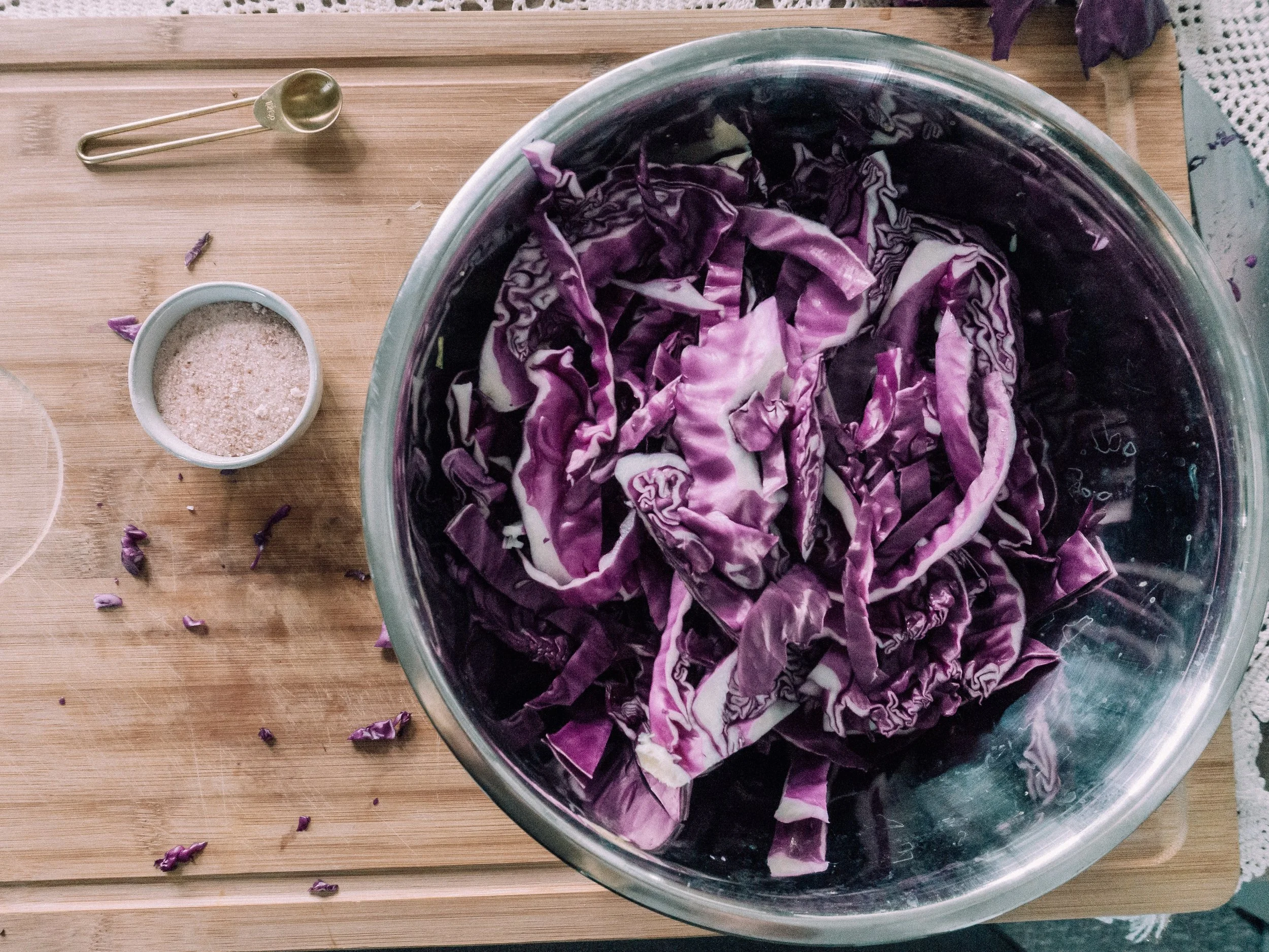 Step 3: Add around 3 teaspoons of the salt and then use hands to mix and massage the cabbage for about 5 minutes until it is broken down and water from cabbage is fully extracted.