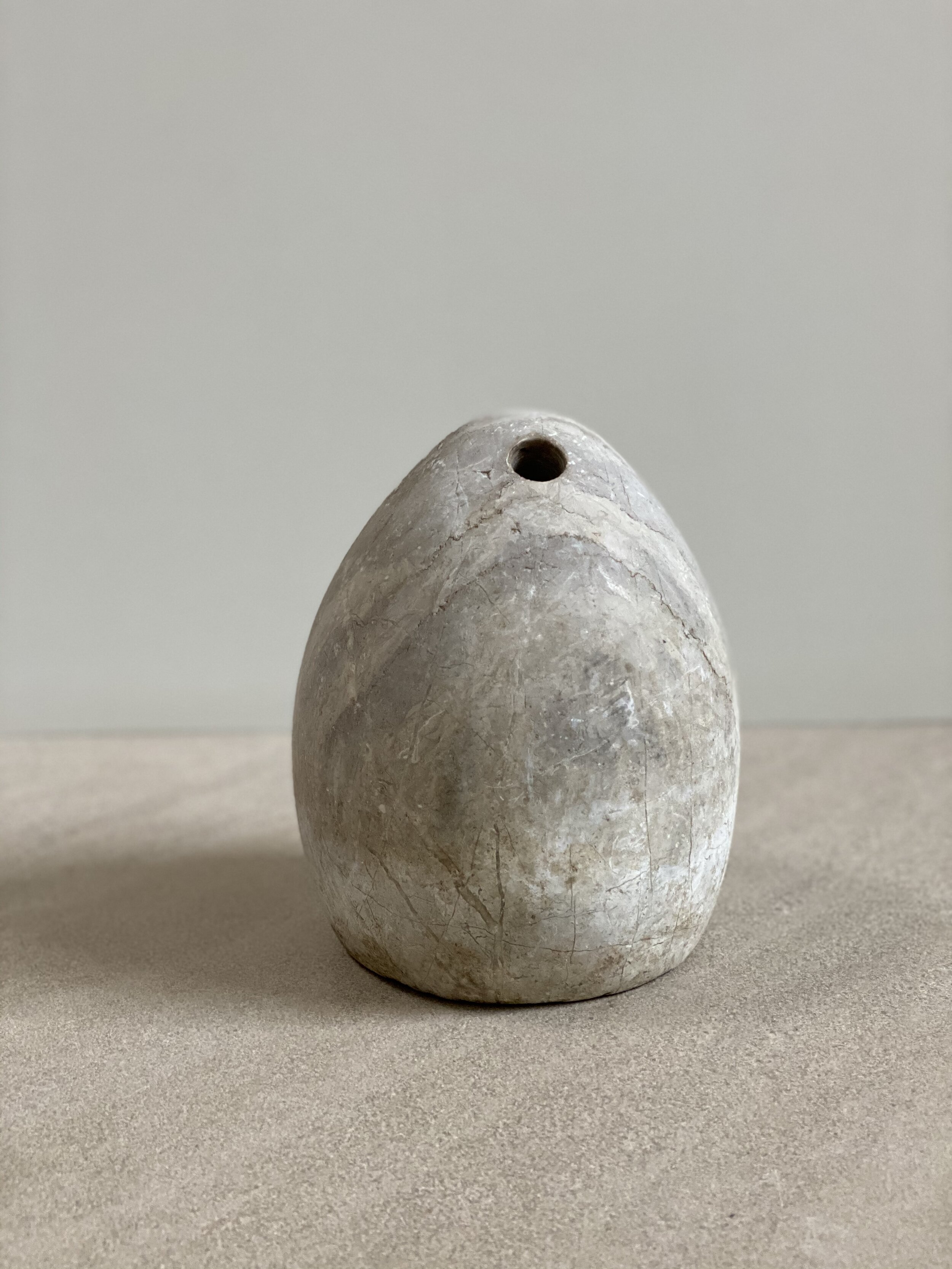 Ovoid pierced idol, Grey Marble, Bactrian, circa 2000 B.C. 8 1/2 inches tall RESERVED