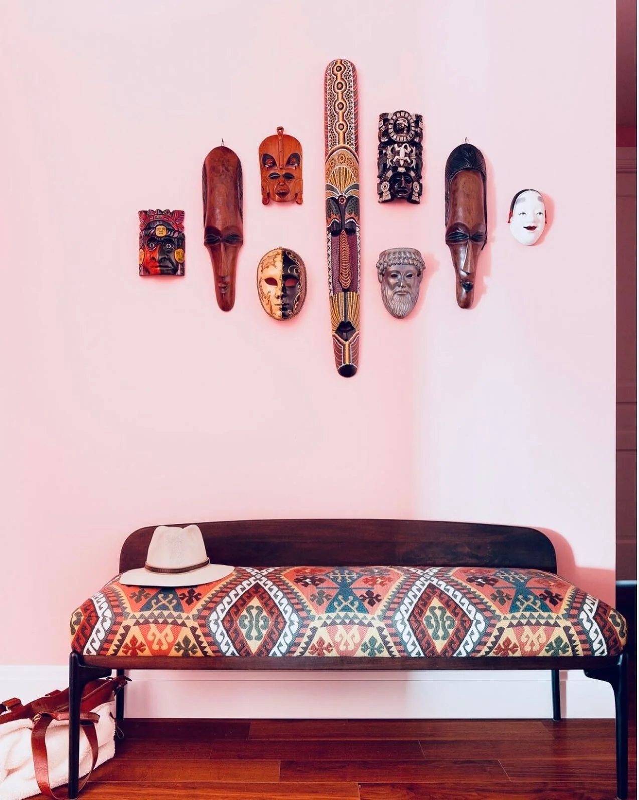 Make an entry ✨✨✨ This entry foyer in my Sutton place project is a mix of my clients collectibles over the years, a mid century bench upholstered in a kilim fabric and their favorite salmon color on the walls. Now who&rsquo;s not going to love walkin